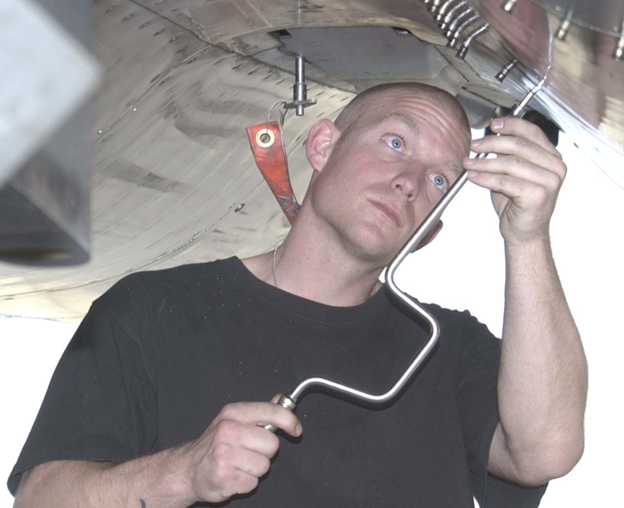 BAGRAM AIRFIELD, Afghanistan -- Staff Sgt. Aaron Jenkins, an aviation propulsion journeyman with the 492nd Expeditionary Aircraft Maintenance Unit here, conducts maintainenace on an F-15E Strike Eagle.  The 455 Air Expeditionary Wing's F-15s provide critical close air support to ground troops throughout Afghanistan. 