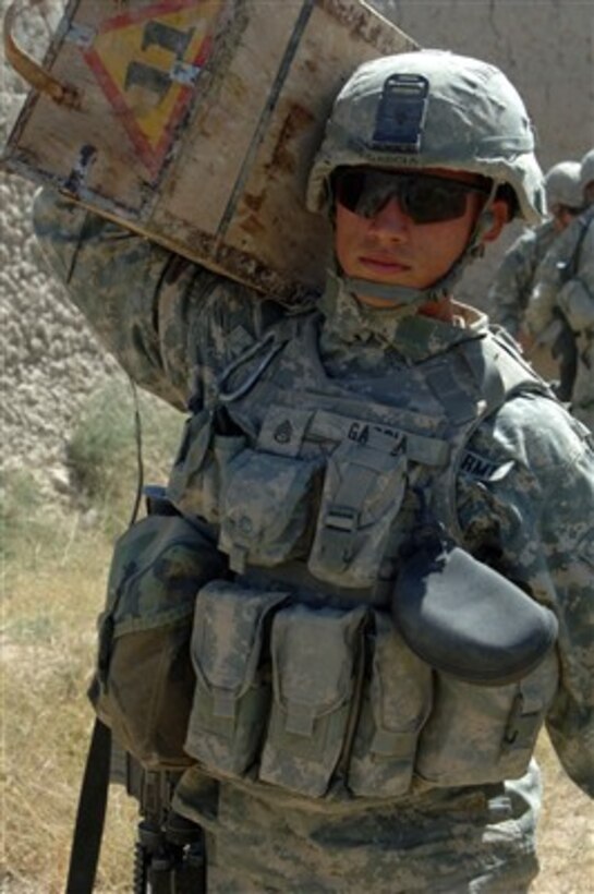A U.S. Army soldier carries a case of mortar rounds found in a weapons cache in Bagi Khel, Afghanistan, on Sept. 12, 2007.  Explosive ordnance technicians will later destroy the mortar rounds and other munitions.  The soldier is attached to Bravo Company, 2nd Battalion, 508th Parachute Infantry Regiment, 82nd Airborne Division.  