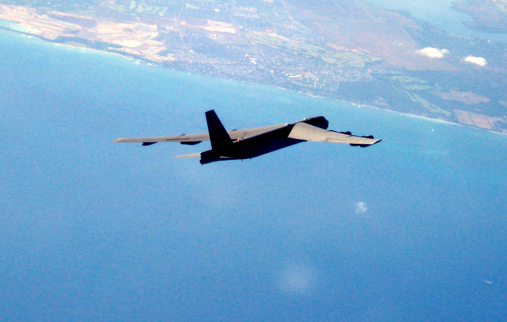 A BUFF is heading toward its target at Pele Bombing Range, Hawaii. For this September’s Koa Lightning, B-52 aircrews dropped inert weapons on their targets for the first time. The aircraft were talked in to the targets by joint tactical air controllers, or JTACs, on the ground. This training is critical in the continuing Global War on Terror, enhances security in the Western Pacific and provides integrated training opportunities. (Courtesy Photo)
