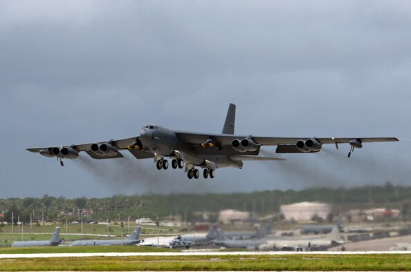 A B-52 bomber, deployed at Andersen Air Force Base, Guam, from Barksdale Air Force Base, La., takes off for September’s Koa Lightning exercise.  For the first time, B-52 crews dropped inert munitions on Pele Bombing Range, Hawaii.  The munitions are made from concrete and have GPS guidance, which make them safe for the environment. This training provides valuable simulated combat experience for the aircrews and translates into raw global combat power against the continuing war on terrorism. (U.S. Air Force photo/Senior Master Sgt. Mahmoud Rasouliyan)