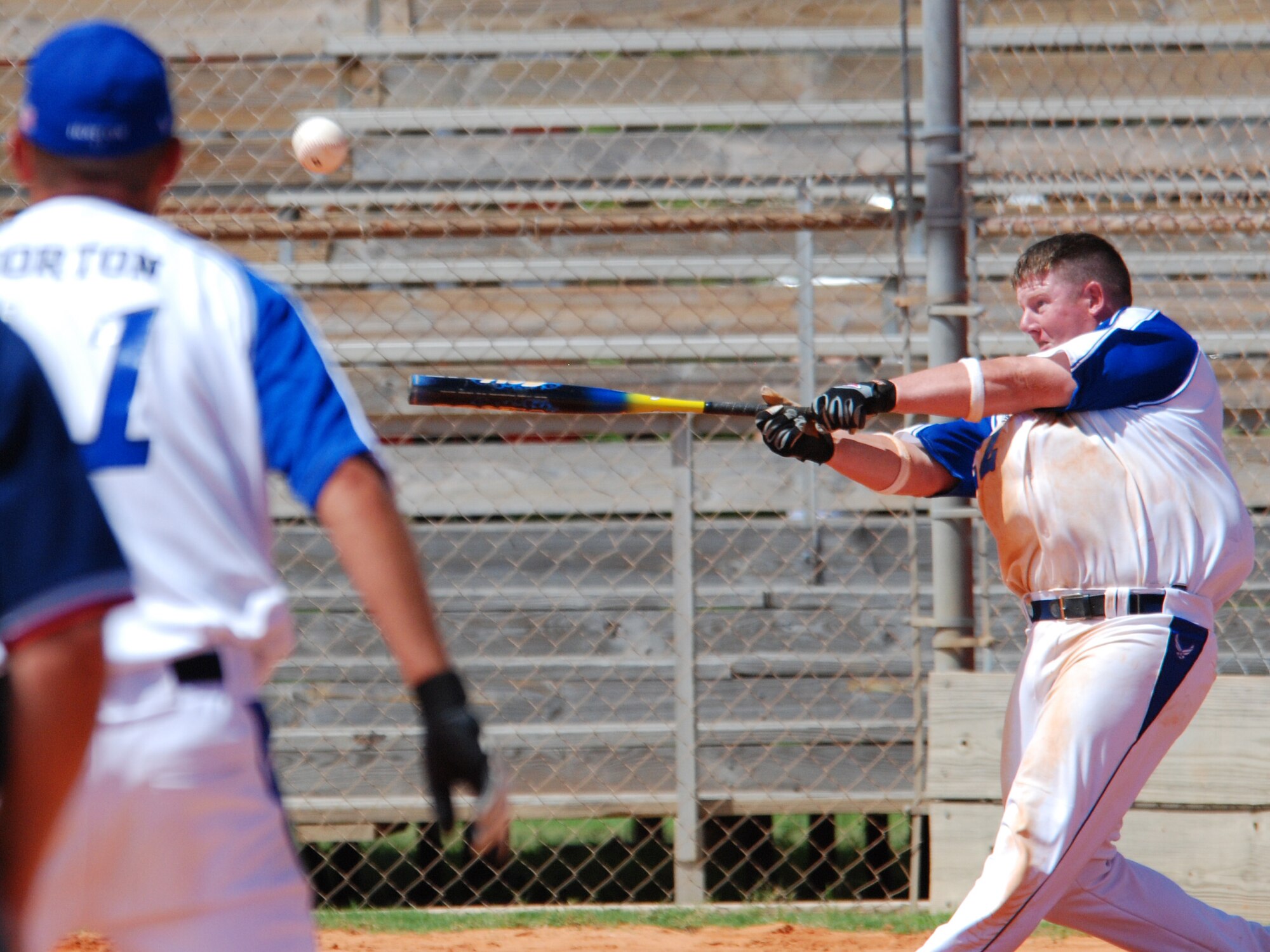 EGLIN AIR FORCE BASE, Fla. -- Joshua Wiggs, all-Air Force firstbaseman, connects with a grand slam in thier first game against the Navy Sept. 12. The 2007 U.S. Armed Forces Men's Softball Championship tournament, featuring the best players from the U.S. Air Force, U.S. Army, U.S. Marine Corps and the U.S. Navy, played the round-robin tournament Sept. 12 - 14 at Foster Stadium here. The all-Army team claim the gold medal while the Marine Corps sqeauked past the Air Force for the Silver. The all-Air Force team has won three championships in a row and four out of the last five. The all-Army team won it in 2003. (U.S Air Force photo by Staff Sgt. MIke Meares)