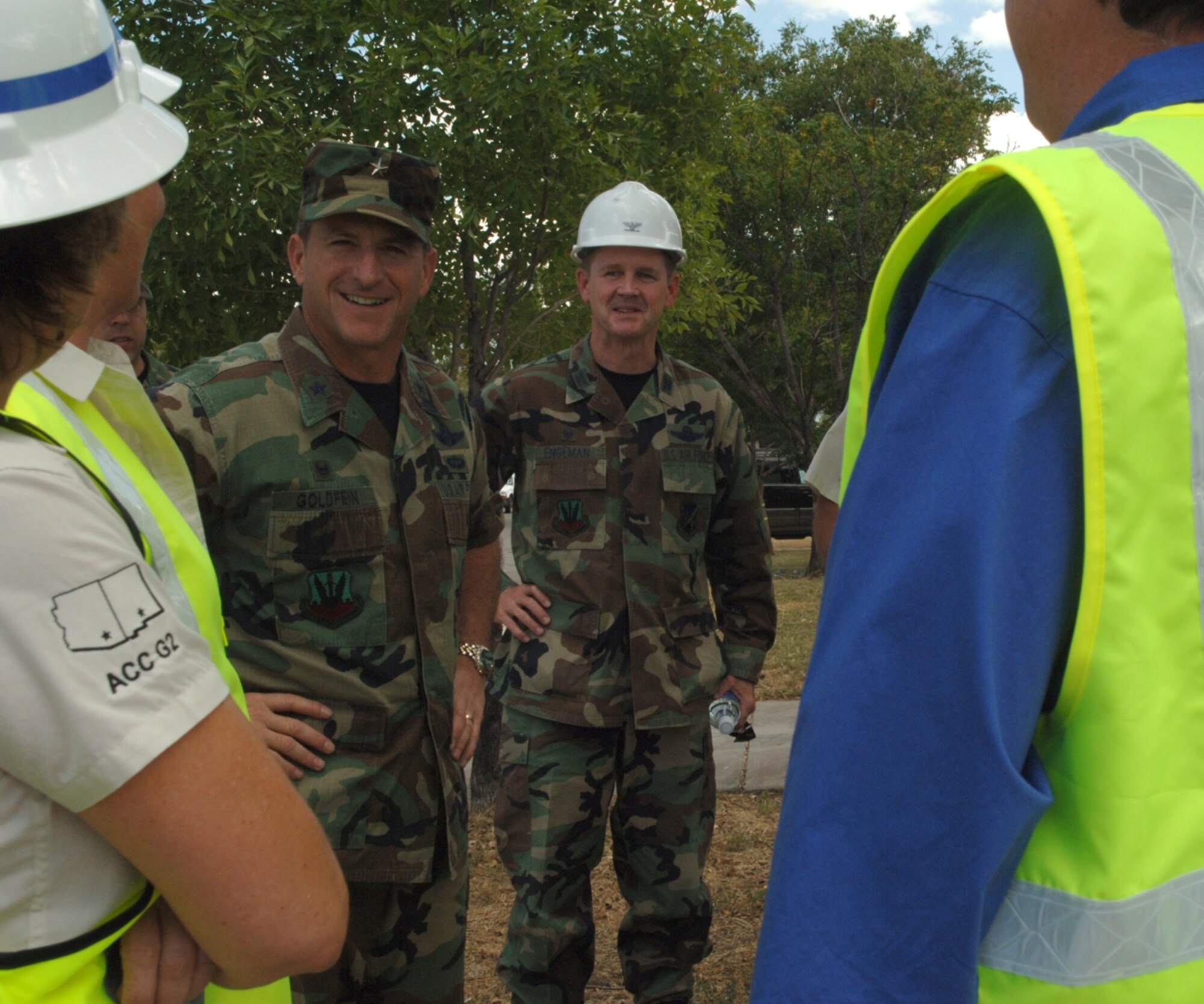 Brig. Gen. David Goldfein, 49th Fighter Wing commander, and Col. Mark Engeman, 49th Mission Support Group commander, talk with the demolition crew Sept. 18 before the demolition of the first house on Holloman. (U.S. Air Force photo/Airman 1st Class Tiffany Trojca)