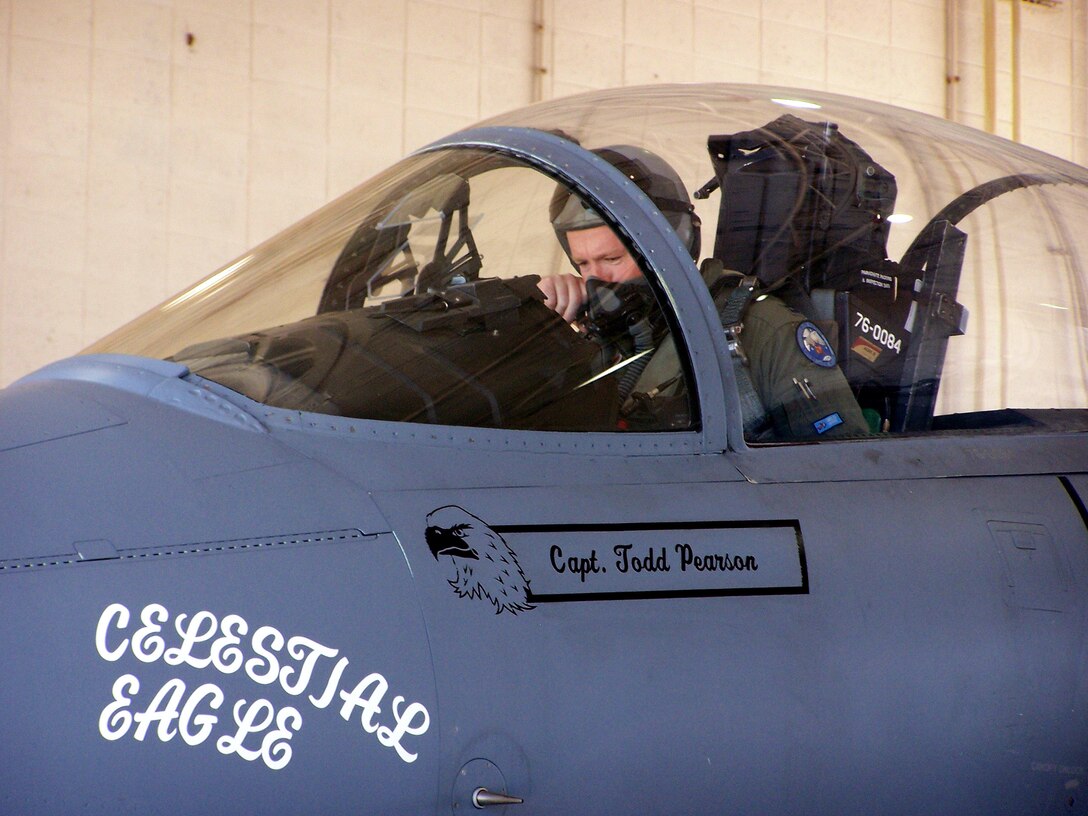 Capt. Todd Pearson performs pre-flight checks on an F-15 Eagle Sept. 13 at Homestead Air Reserve Base, Fla., during the Celestial Eagle Remembrance Flight. Captain Pearson is with the 390th Fighter Squadron at Mountain Home Air Force Base, Idaho. Captain Pearson's father, retired Maj. Gen. Doug Pearson, flew the exact same F-15, now assigned to the 125th Fighter Wing at Homestead, exactly 22 years prior while accomplishing the only successful satellite kill by an aircraft launched missile in history. (U.S. Air Force photo/Senior Airman Erik Hofmeyer) 