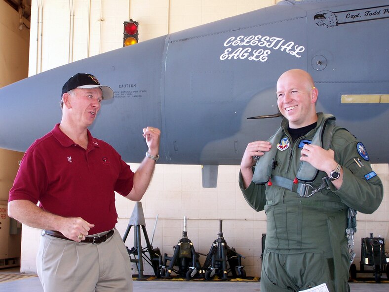 Retired Maj. Gen. Doug Pearson (left) and Capt. Todd Pearson, a 390th Fighter Squadron pilot from Mountain Home Air Force Base, Idaho, joke around Sept. 13 prior to Captain Pearson taking off on the Celestial Eagle remembrance flight at Homestead Air Reserve Base, Fla. General Pearson flew the exact same F-15 Eagle, now assigned to the Florida Air National Guard 125th Fighter Wing, exactly 22 years prior while accomplishing the only successful satellite kill by an aircraft launched missile in history. (U.S. Air Force photo/Senior Airman Erik Hofmeyer) 