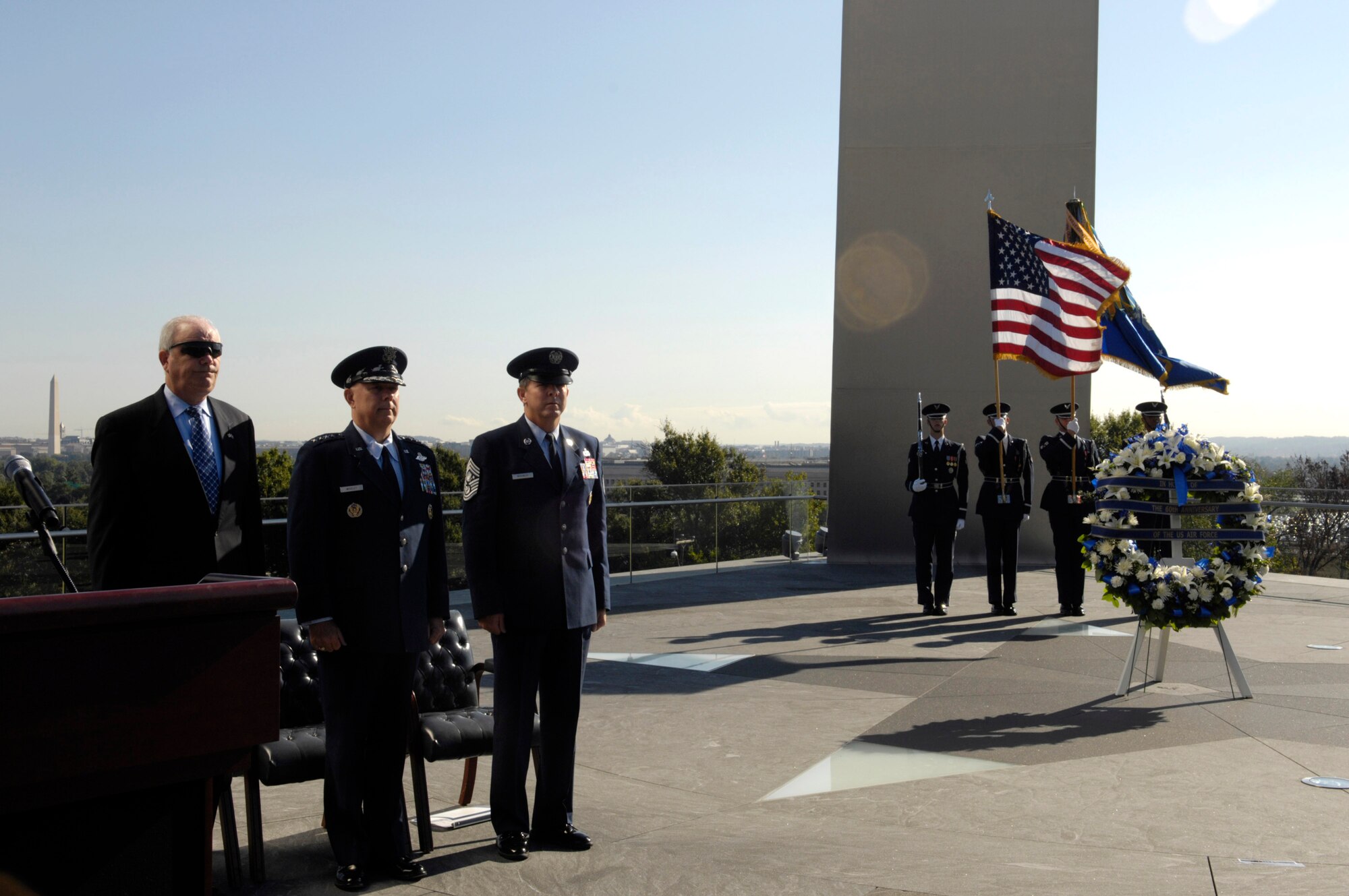 Secretary of the Air Force Michael W. Wynne, Air Force Chief of Staff Gen. T. Michael Moseley and Chief Master Sgt. of the Air Force Rodney J. McKinley stand at attention during the wreath-laying ceremony Sept. 18 at the Air Force Memorial in Arlington, Va., in honor of the 60th anniversary of the Air Force. (U.S. Air Force photo/Senior Airman Rusti Caraker)