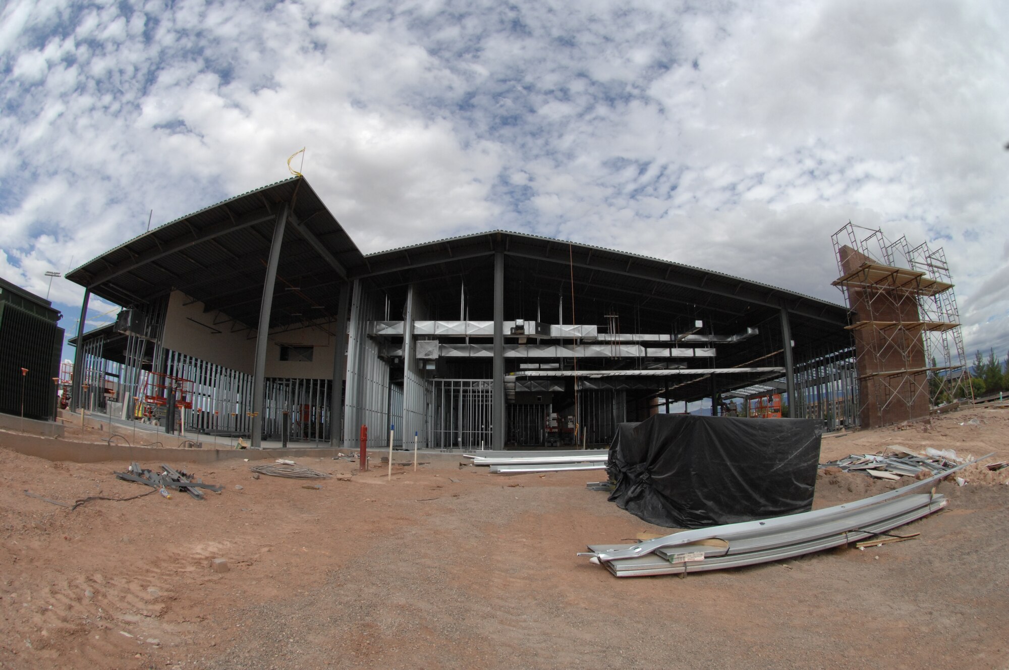 Construction of the Holloman fire department has been in progress since December 2006 and is projected to be finished in July 2008. Contractors are working to upgrade the facility to the measurements of 371.4 (length) by 153.4 (width) feet. Since the upgrade construction of the Holloman fire department; Holloman's fire department is
looking at the possibility of dispatching emergencies for not only the firefighters, but also the 49th Security Forces Squadron and medical first responders with a consolidated 9-1-1 dispatch center. (U.S. Air Force photo by Senior Airman Anthony Nelson)
