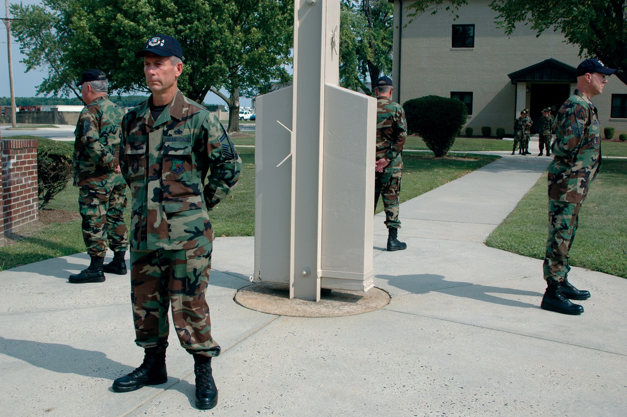 DOVER AIR FORCE BASE, Del. -- Sergeants from the Air Force Reserve Command's 512th Airlift Wing here stand in solemn rememberance of POW/MIAs Sept. 14 at the base flagpole. Squadrons throughout the base took turns standing in recognition. 
