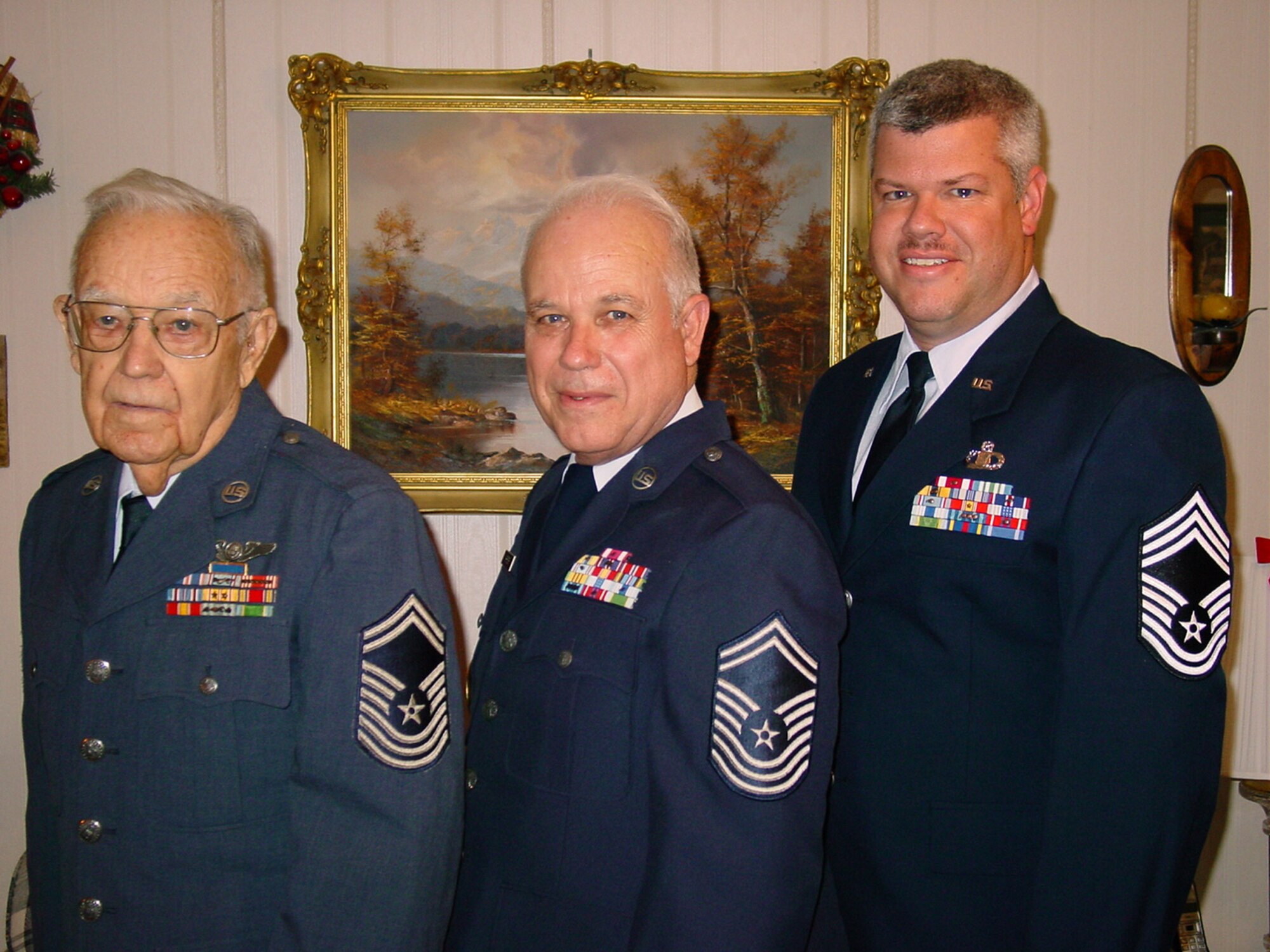 (L – R) Chief Master Sergeants Harold E. Shreiner, Larry F. Shreiner, and Glenn F. Shreiner, pose for a photo of three generations of chief master sergeants with a combined service of 72 years. Chief Master Sgt. Glenn Shreiner, chief air traffic controller at Altus Air Force Base, Okla., was pinned in August. His father and grandfather wear the older version of chief master sergeant chevrons used during the periods they served.