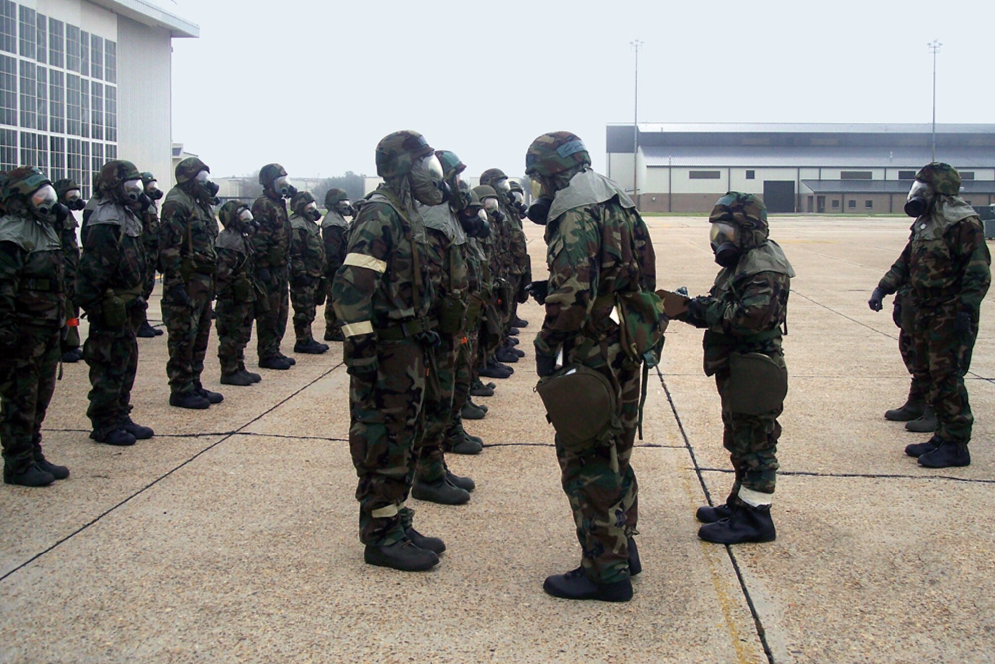 Getting ready for the upcoming Operational Readiness Exercise in September and Operational Readiness Inspection in December, the 41st Aerial Port Squadron conducted an in-ranks inspection during the June Unit training assembly. Citizen Airmen throughout the wing have been testing their Ability to Survive and Operate  by donning the protective gear each UTA and conducting additional training both in the chemical warfare gear and in classroom settings. (U.S. Air Force Photo/Tech. Sgt. Steve Martin)