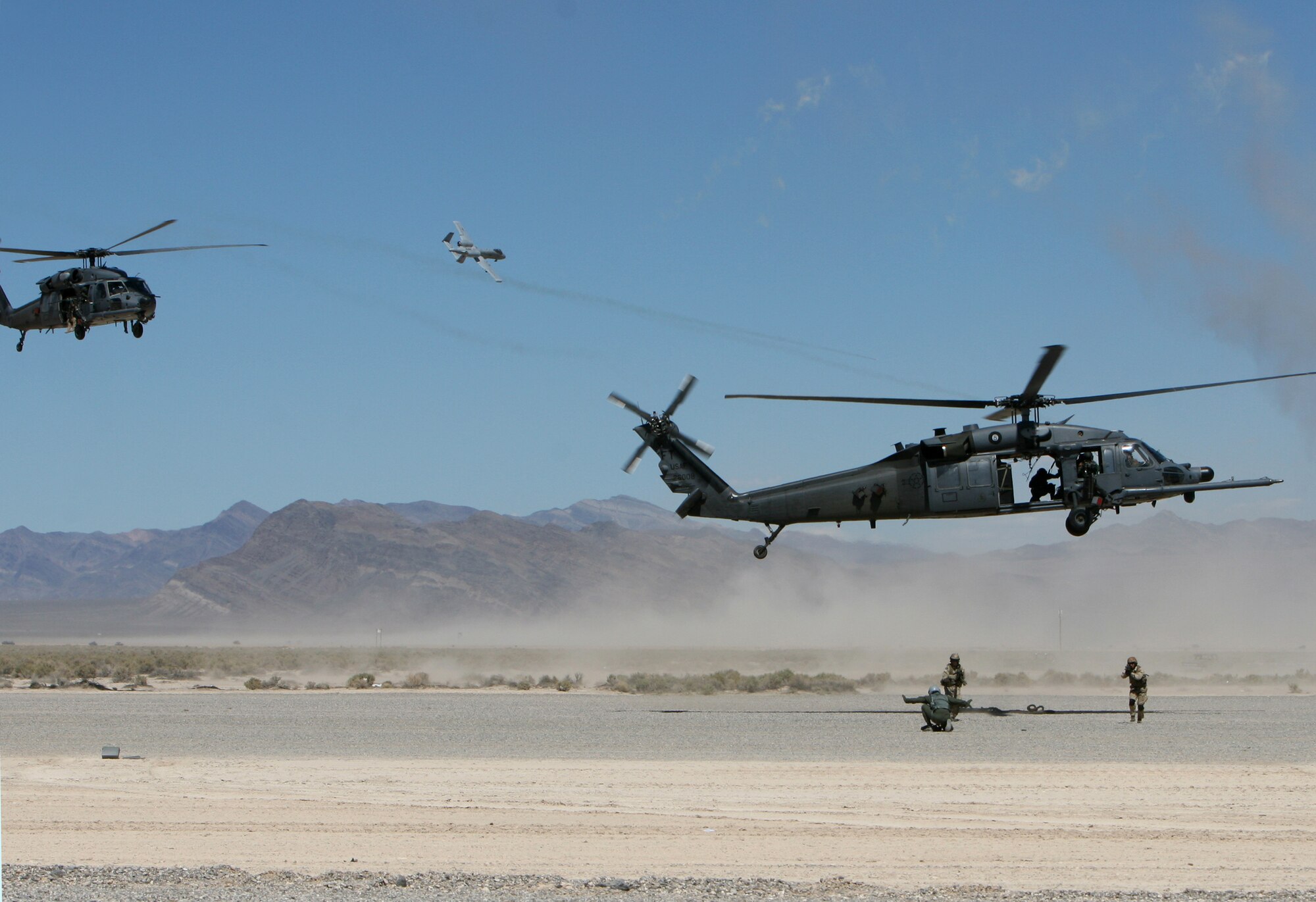 A pararescueman from the 58th Rescue Squadron, Nellis Air Force Base, Nev., scans terrain during combat search and rescue operations Sept. 14, 2007, during a firepower demonstration on the Nevada Test and Training Range.  The demonstration gives the public a close-up and realistic view into the Air Force's ability to perform its wartime mission.  
(USAF photo by Master Sgt. Kevin J. Gruenwald) 
