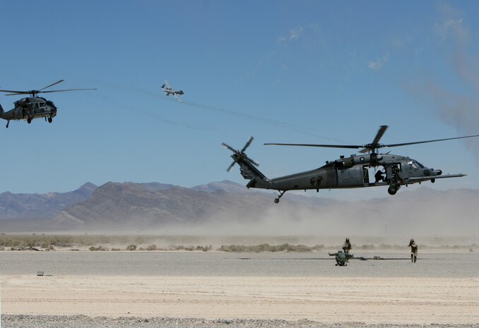A pararescueman from the 58th Rescue Squadron, Nellis Air Force Base, Nev., scans terrain during combat search and rescue operations Sept. 14, 2007, during a firepower demonstration on the Nevada Test and Training Range.  The demonstration gives the public a close-up and realistic view into the Air Force's ability to perform its wartime mission.  
(USAF photo by Master Sgt. Kevin J. Gruenwald) 
