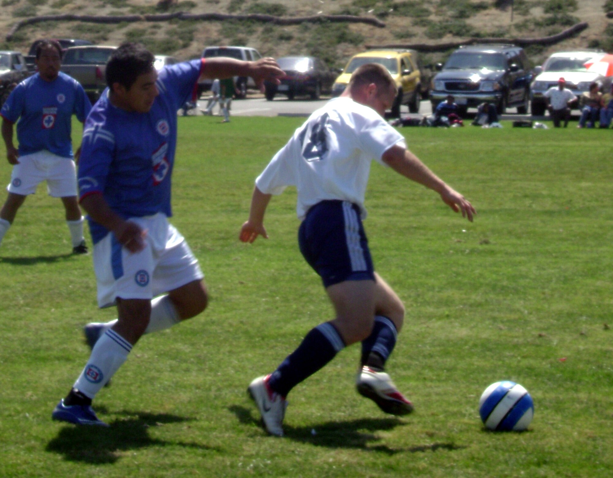 VANDENBERG AIR FORCE BASE, Calif. -- Anthony Sligar dribbles around a Cruz Azul defender.  Vandenberg HAWKS crushed Cruz Azul 6-0 in varsity soccer action in Santa Maria on Sept. 16. (U.S. Air Force photo/Staff Sgt. Radoslaw Ciesielski)