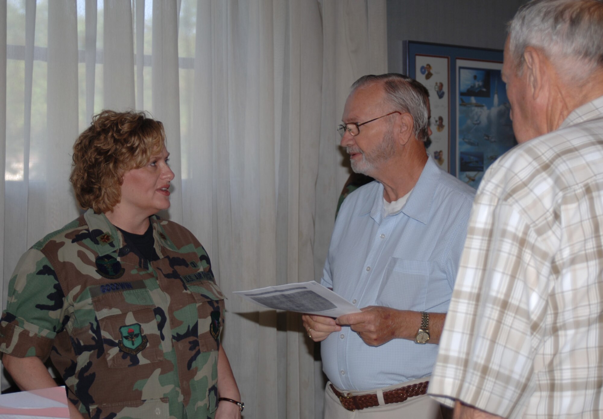 Major Trena Goodwin, 14th Medical Support Squadron, speaks to a retiree at the Retiree Appreciation Day Saturday at the Columbus Club. The retirees received information from base agencies, such as the pharmacy and TriCare, and community information from various agencies including the Columbus-Lowndes Development Link. (U.S. Air Force photo by Airman 1st Class Danielle Powell)