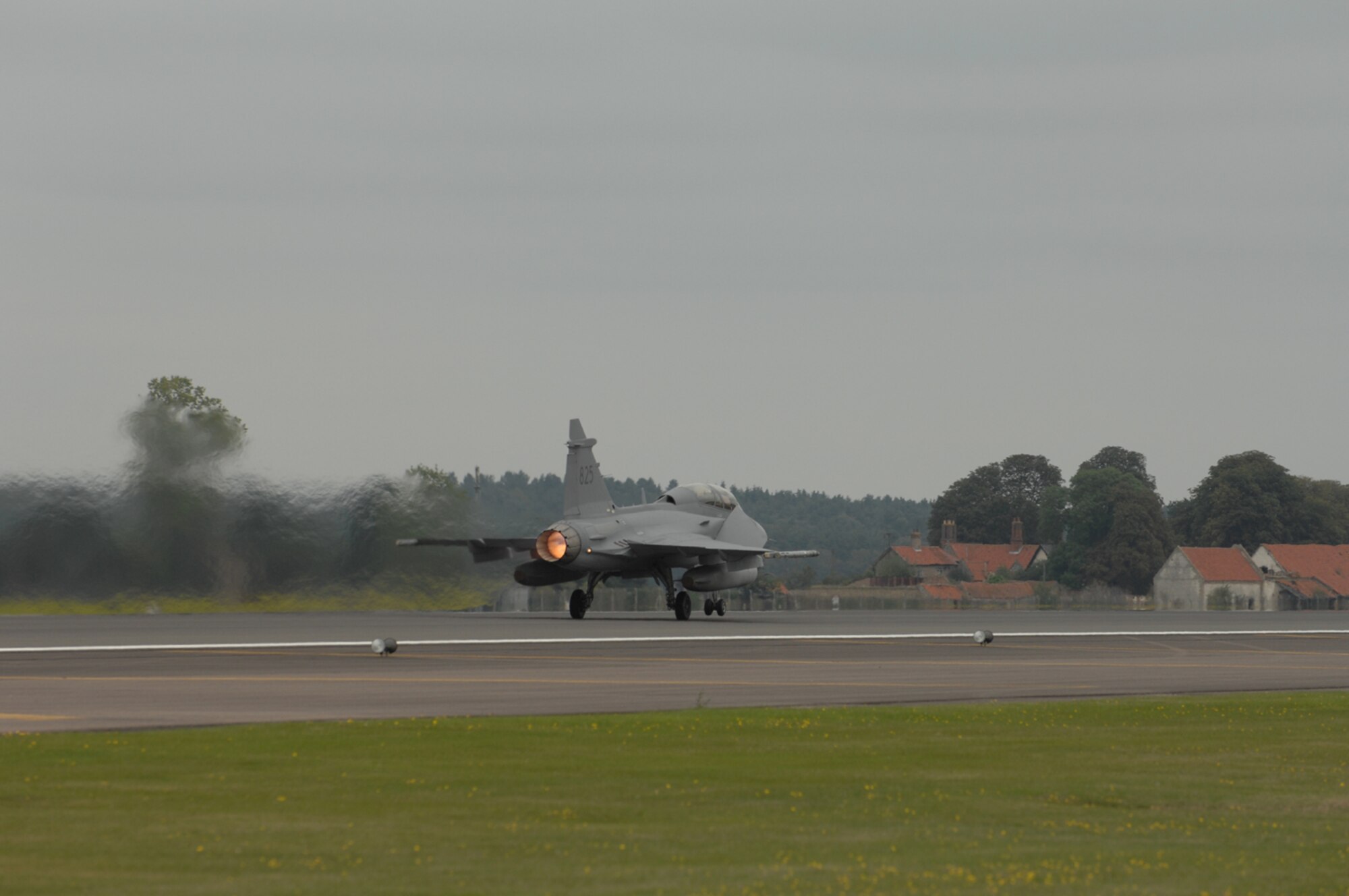 A Swedish JAS-39 takes off from the flightline at RAF Lakenheath. Swedish Gripen air and ground crews visited the 493rd Fighter Squadron Sept. 4 through 12 as part of an international squadron exchange program. The squadrons competed against each other in 1 vs. 1, 2 vs. 1 and 4 vs. 4 air combat maneuvers and tactical intercept missions. (U.S. Air Force photo by Airman 1st Class John Easterling)
