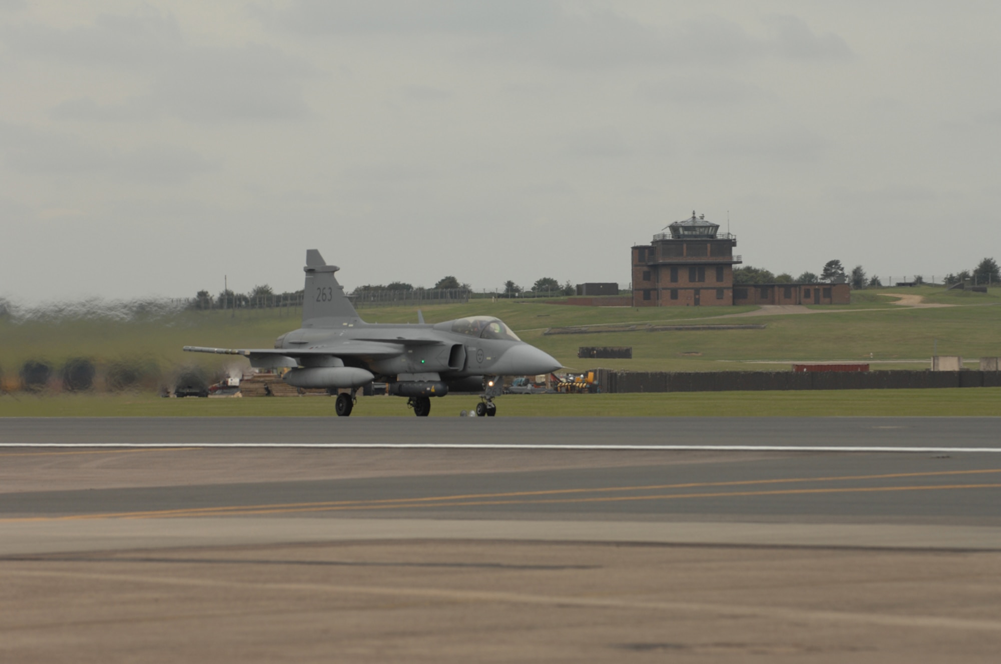 A Swedish JAS-39 takes off from the flightline at RAF Lakenheath. Swedish Gripen air and ground crews visited the 493rd Fighter Squadron Sept. 4 through 12 as part of an international squadron exchange program. The squadrons competed against each other in 1 vs. 1, 2 vs. 1 and 4 vs. 4 air combat maneuvers and tactical intercept missions. (U.S. Air Force photo by Airman 1st Class John Easterling)
