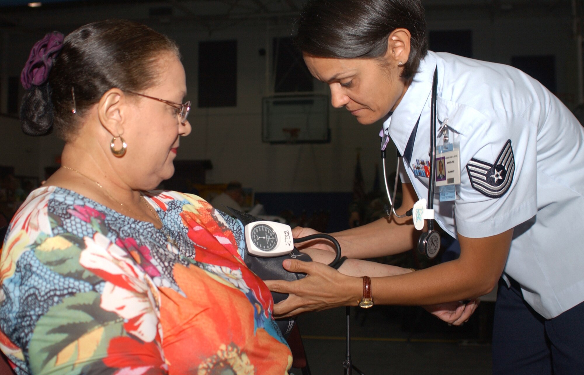 Joy Martin of New Orleans has her blood pressure checked by Tech. Sgt. Amanda Fisk, 81st Medical Operations Squadron.  Mrs. Martin’s husband, Frank, is a retired master sergeant.  Keesler Medical Center provided various health screenings and information about Tricare, dermatology, pharmacy, smoking cessation, osteoporosis, dental care and other health topics.  (U,S. Air Force photo by Kemberly Groue)
