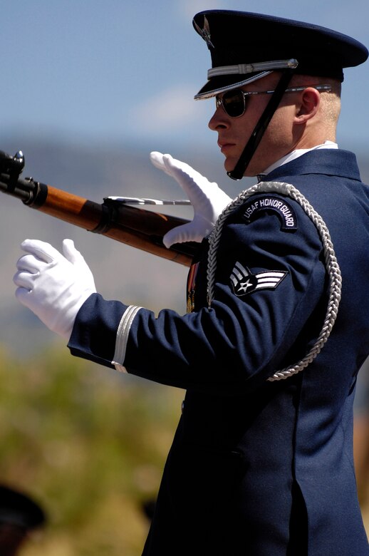 Senior Airman Michael Rowe of the Air Force Honor Guard Drill Team performs Sept. 14 at the Sandia Resort's outdoor amphitheatre in Albuquerque, N.M., before the New Mexico State Air Force 60th Anniversary Ball . (U.S. Air Force photo/Senior Airman Daniel DeCook) 