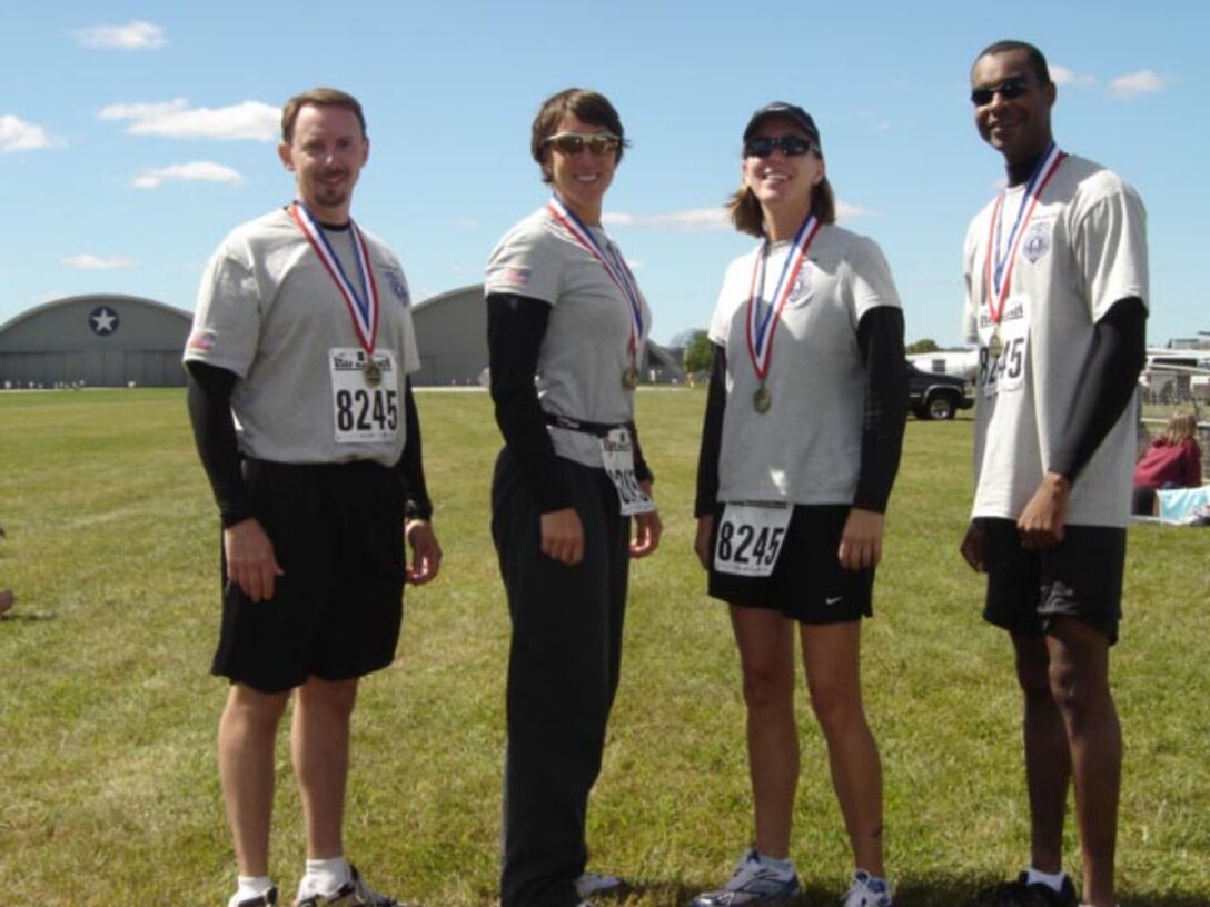 AF OSI Special Agents Dave Yeager, Carolyn Rocco, Elizabeth Richards and Anthony Parkinson competed as a team in the Air Force Marathon Sept. 15, in memory of seven agents killed in the line of duty.