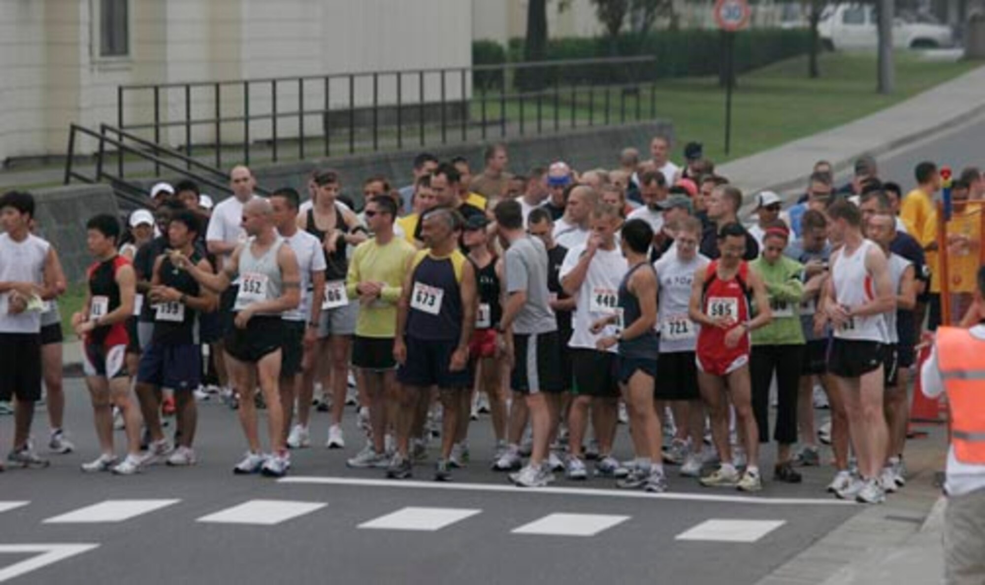 MISAWA AIR BASE, Japan -- More than 80 people line up for the start of the 1st annual "Race the Base" perimeter run Sept. 15. With a start time of 8 a.m., there was no time limit set to run the 8.5 mile course. (U.S. Air Force photo)