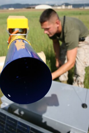 Cpl. Ryan A. Pope, Headquarters and Headquarters Squadron telephone systems/personal computer intermediate repairer and native of Union, Mo., works on a cannon used to keep birds away from the flight line here Sept. 19. Six such cannons are currently being implemented under the new Cordless Land-Air Wildlife System.