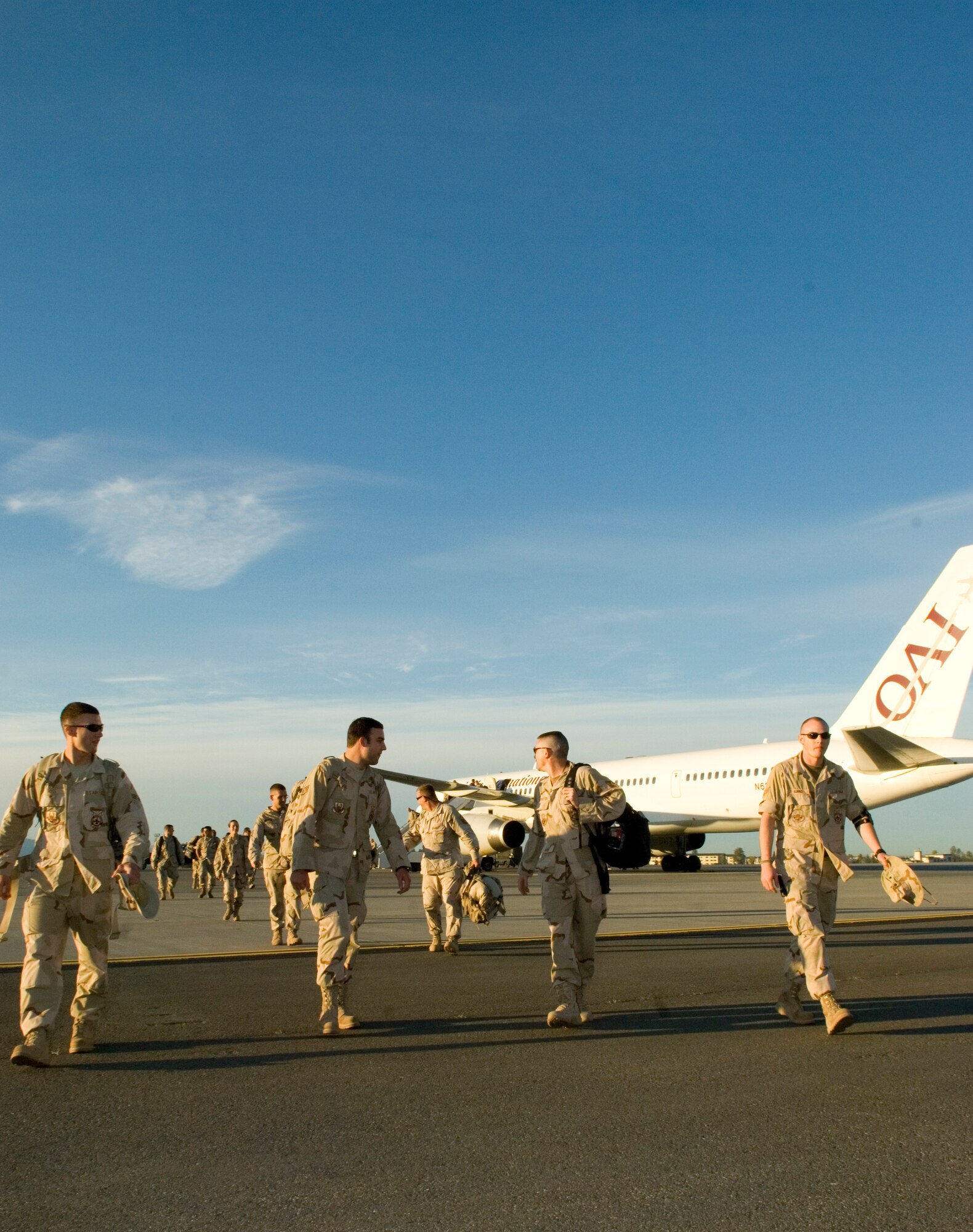 ELMENDORF AIR FORCE BASE, Alaska -- More than 40 Airman assigned to Air Expeditionary Forces 7 and 8 disembark from a commercial 757 parked on the runway here. The Airmen return home from their deployed locations Sept. 17 and were greeted by friends and families awaiting their arrival at the Joint Military Complex. (U.S. Air Force photo/Senior Airman Garrett Hothan)