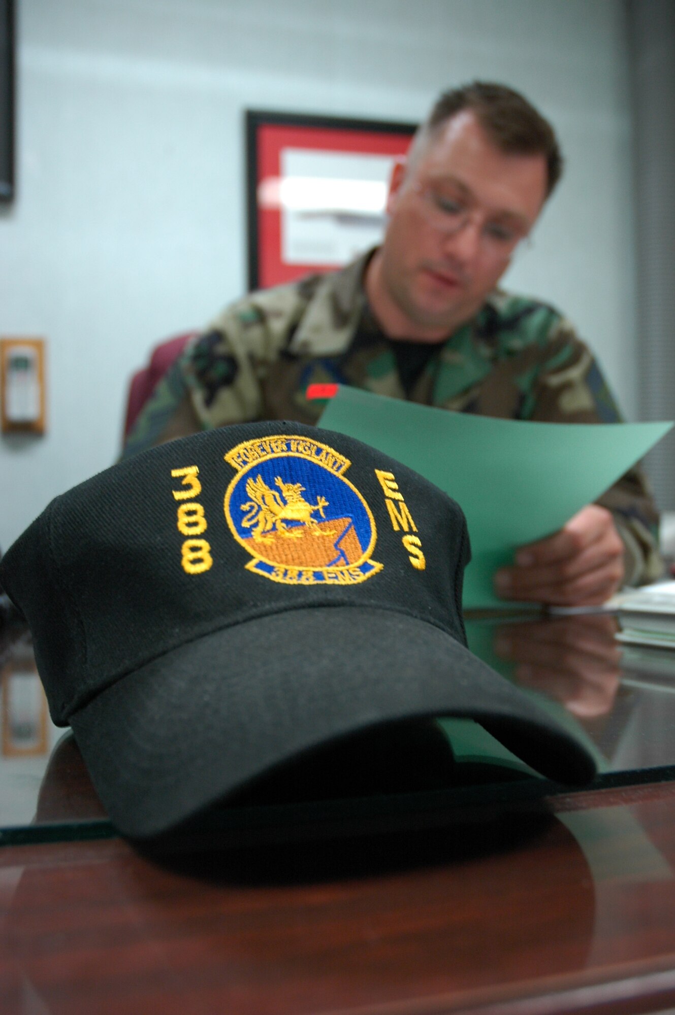 HILL AIR FORCE BASE, Utah-- Senior Master Sgt. Scott Martin, first sergeant for the 388th Equipment Maintenance Squadron, under the 388th Fighter Wing, reviews an Airman's personnel information file. (U.S. Air Force photo by Capt. Genieve David)