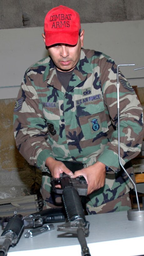 9/17/2007 - Tech. Sgt. Richard D. Bribiesca, 302nd Security Forces combat arms instructor, completes the final stages of an inspection on an M-16 rifle prior to the 302nd Airlift Wing's Operational Readiness Exercise.  Sergeant Bribiesca and other members of the 302nd Security Forces Squadron cleaned hundreds of M-16s and M-9 weapons to ensure 100 percent inventory for the higher headquarters inspection. (U.S. Air Force photo/SSgt Derrick M. Gildner)