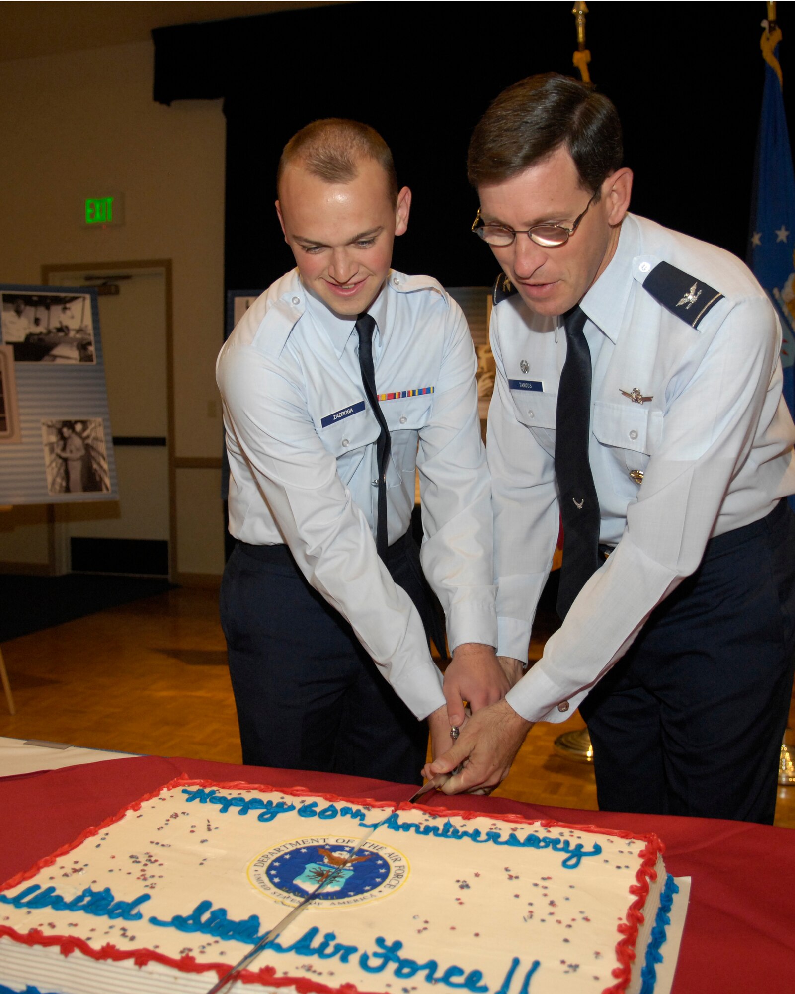 VANDENBERG AIR FORCE BASE, Calif. -- 30th Space Wing commander Col. Steve Tanous and Vandenberg's newest Airman, Airman Basic Christopher Zadroga of the 533rd Training Squadron, cut the Air Force birthday cake in celebration of the Air Force's 60th birthday during the ceremony at the Pacific Coast Club on Sept. 18. The cake cutting ceremony was preceded by a retreat ceremony in front of Bldg. 10577. (U.S. Air Force photo/Airman 1st Class Matthew Plew)