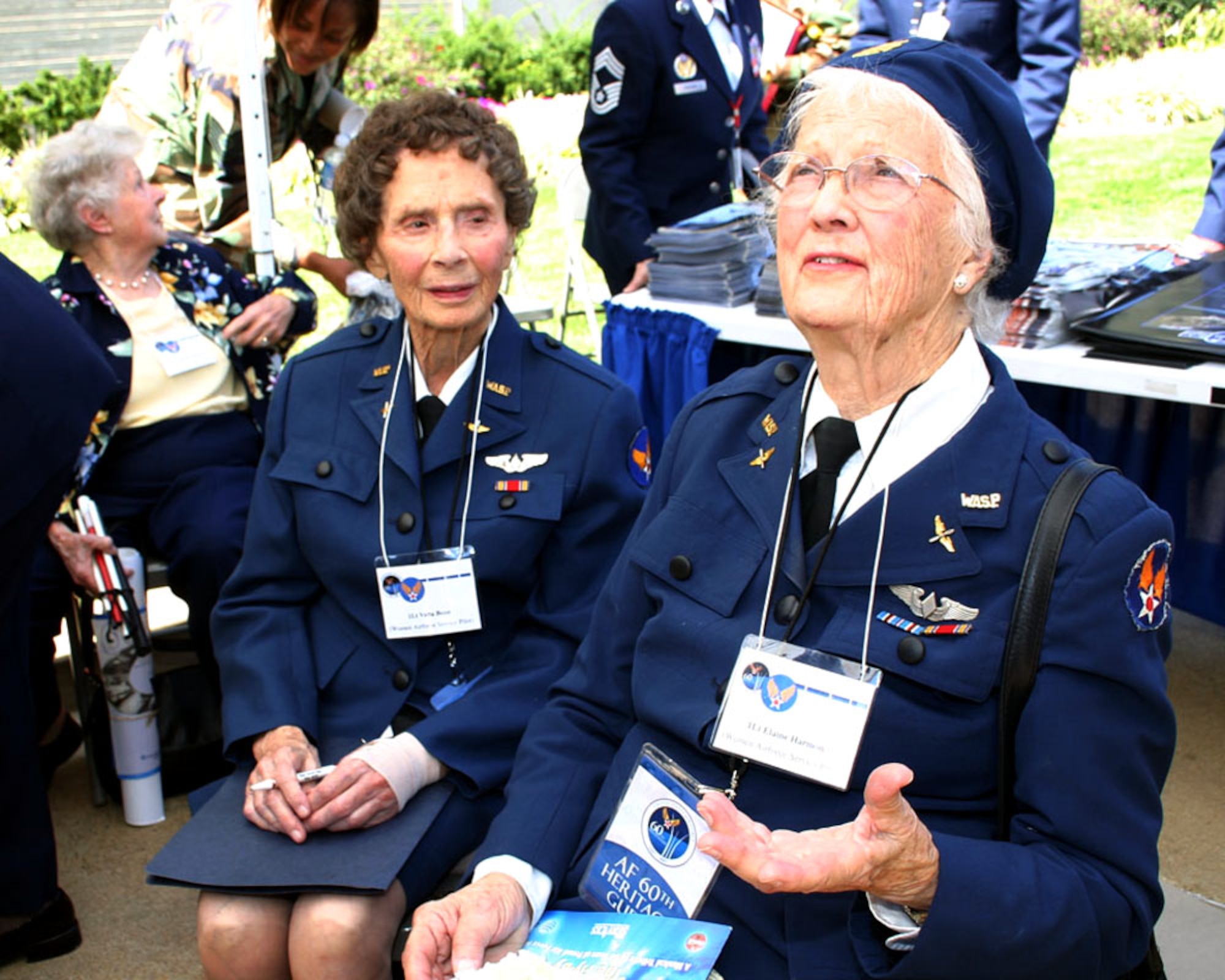 Women Airforce Service Pilot 1st Lieutenants Velta Benn and Elaine Harmon speak to guests at the Air Force 60th anniversary celebration in the Pentagon courtyard Sept. 18.  WASPs performed flying duties during World War II like ferrying aircraft from factories to military bases and towing targets for gunnery training.  (U.S. Air Force photo/Senior Master Sgt. Ray Sarracino)