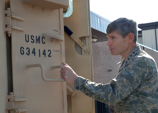 Gen. Norton Schwartz, United States Transportation Command commander, takes a look inside a mine resistant ambush protected vehicle as he toured the 437th Aerial Port Squadron during his visit to the base Monday.  MRAPs are news vehicles being sent overseas to aid Marines and Soldiers in the Global War on Terrorism(U.S. Air Force photo/Airman 1st Class Cynthia Spalding) 