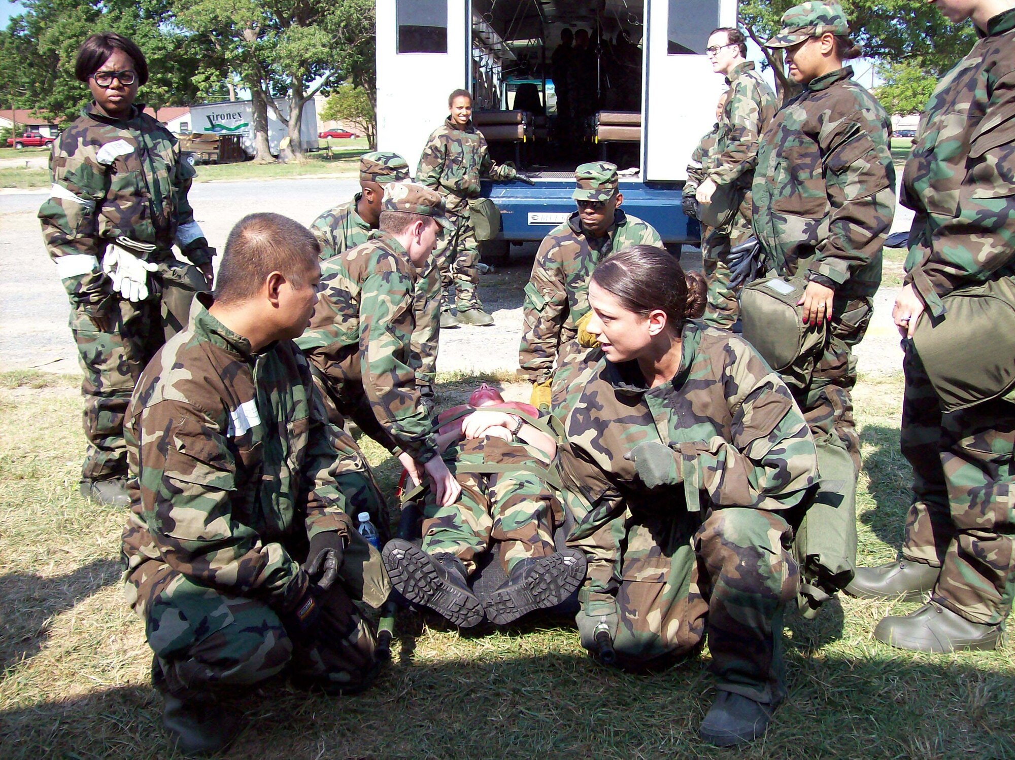 ANDREWS AIR FORCE BASE, Md. -- Tech. Sgt.  Eric Londres and Staff Sgt. Jean Giacobbe discuss patient transfer during a mass casualty exercise here Sept. 9. Sergeant Londres and Sergeant Giacobbe are medical services technicians with the 459th Aeromedical Staging Squadron. (U.S. Air Force photo/Capt. Sheila Arrington)