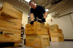 Staff Sgt. Sam Kunz, 437th Maintenance Squadron munitions systems craftsman hammers lids on wooden boxes containing countermeasure flares for  the C-17 in the Charleston AFB, S.C. munitions bay Sept. 11.  (U.S. Air Force photo/Airman 1st Class Nicholas Pilch) 

