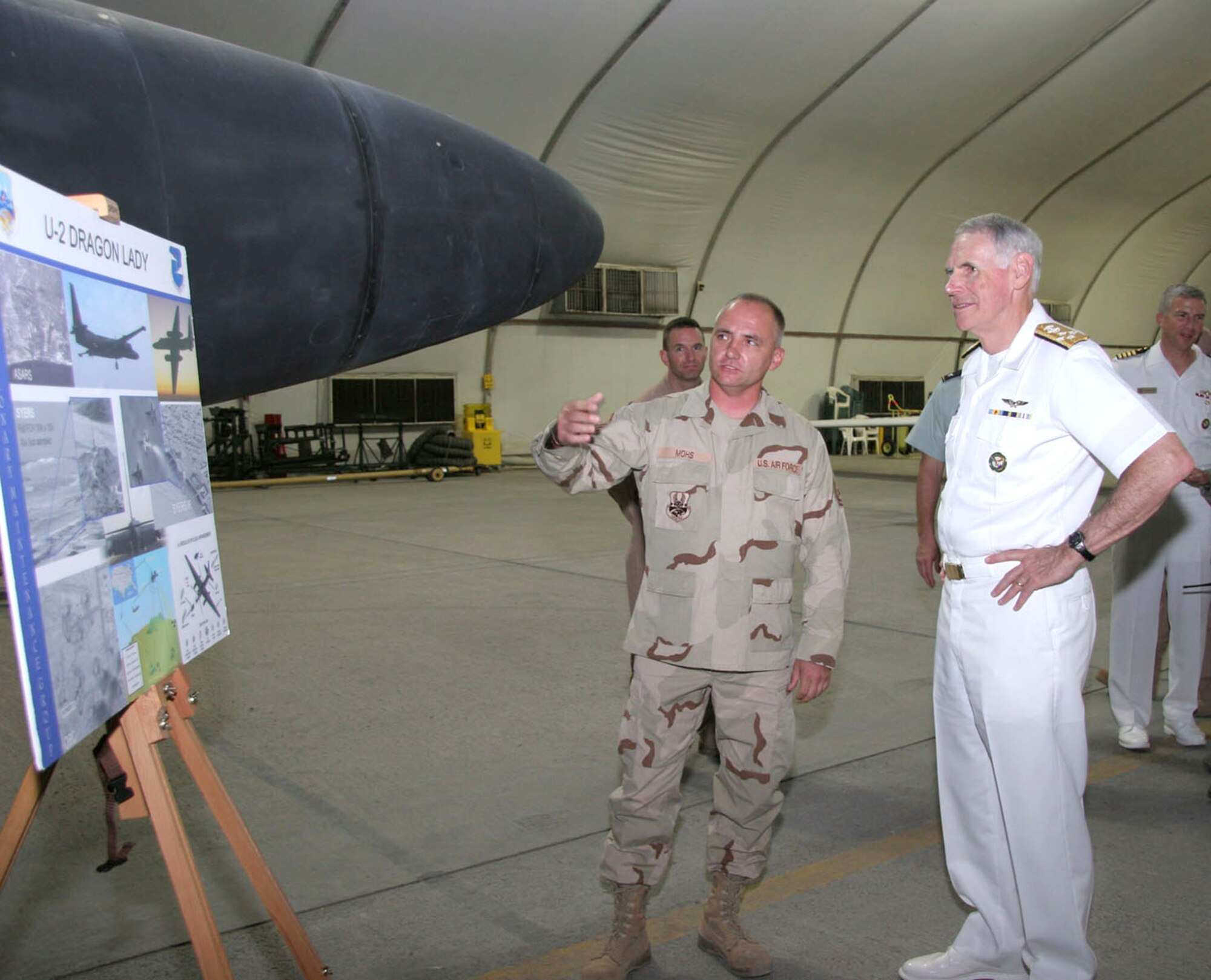 Master Sgt. Todd Mohs briefs Adm. William J. Fallon and his staff on the capabilities of the U-2 aircraft and its mission Sept. 17 during the general's visit to the 380th Air Expeditionary Wing in Southwest Asia. Admiral Fallon is the U.S. Central Command commander and Sergeant Mohs is a crew chief with the 380th Expeditionary Aircraft Maintenance Squadron. (U.S. Air Force photo/Master Sgt. Ruby Zarzyczny)