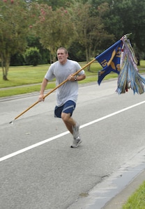 Airman 1st Class Joseph VonDohlen, 15 Airlift Squadron, finishes the run for the Commanders Fitness Challegenge Sept. 14 on base. (U.S. Air Force photo/Airman 1st Class Katie Gieratz)