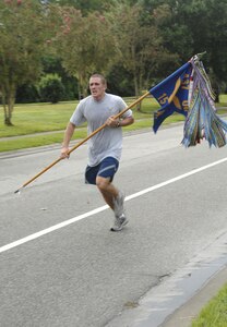 Airman 1st Class Joseph VonDohlen, 15 Airlift Squadron, finishes the run for the Commanders Fitness Challegenge Sept. 14 on base. (U.S. Air Force photo/Airman 1st Class Katie Gieratz)