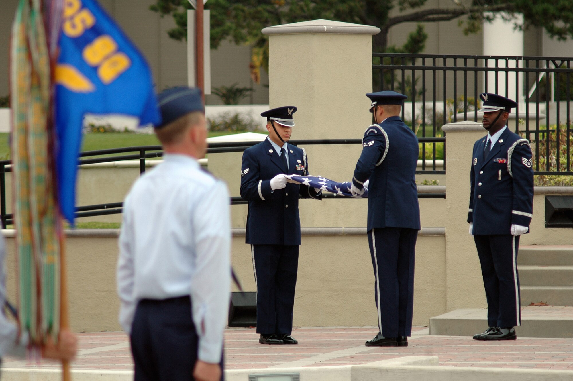 VANDENBERG AIR FORCE BASE, Calif. -- Vandenberg's Honor Guardsmen hold the retreat ceremony in front of formations of the four 30th Space Wing groups, the 381st Training Group and the 595th Space Group.  The retreat ceremony, held Sept. 18 to celebrate the Air Force's 60th Anniversary, was followed by a cake cutting ceremony. (U.S. Air Force photo/Senior Airman Stephen Cadette)