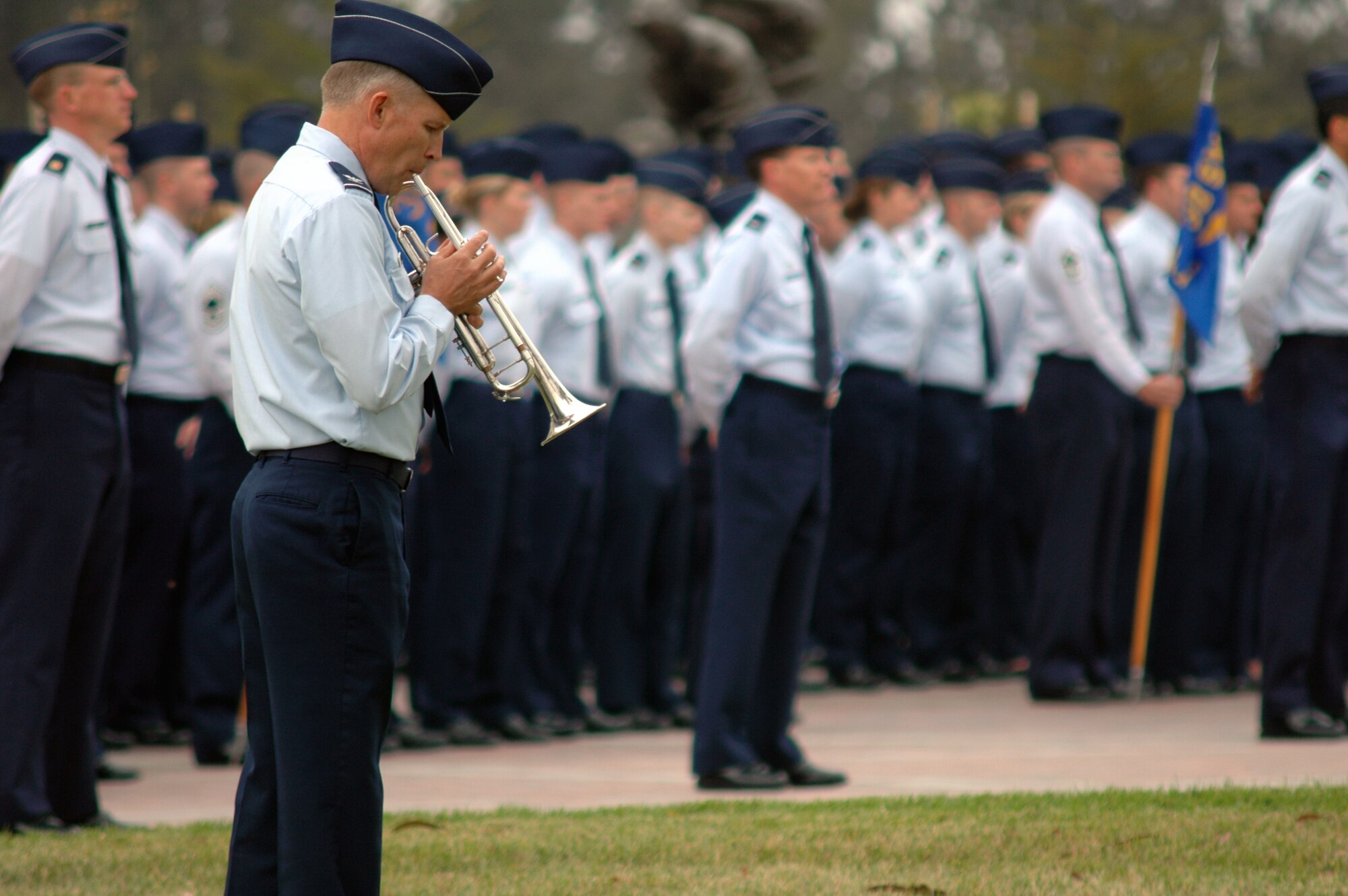 VANDENBERG AIR FORCE BASE, Calif. -- Col. Gerald Wirsig warms up before playing the national anthem in front of formations of Vandenberg's four 30th Space Wing groups, the 381st Training Group and the 595th Space Group during a retreat ceremony on Sept. 18 in front of Bldg. 10577 to celebrate the Air Force's 60th Anniversary. The retreat was followed by a cake cutting ceremony in the Pacific Coast Club.  (U.S. Air Force photo/Senior Airman Stephen Cadette)