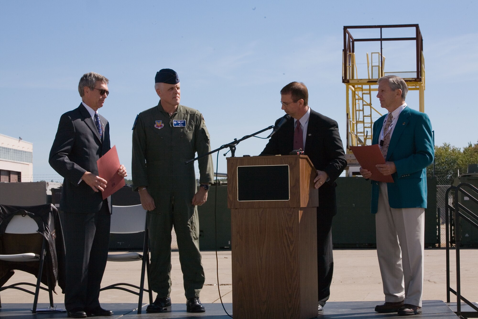 New York State Senator Joseph Griffo presents citations to (from right to left) Dr. Don Hanson, Air Force Research Laboratory Information Directorate director, Col. Clark Speicher, Northeast Air Defense Sector commander and Mr. Tony Kimball, from the 465th Fighter Interceptor Squadron reunion tour Sept. 18. The commemorative events were held at the AFRL Hangar located at Griffiss Business and Technology Park in Rome, N.Y.