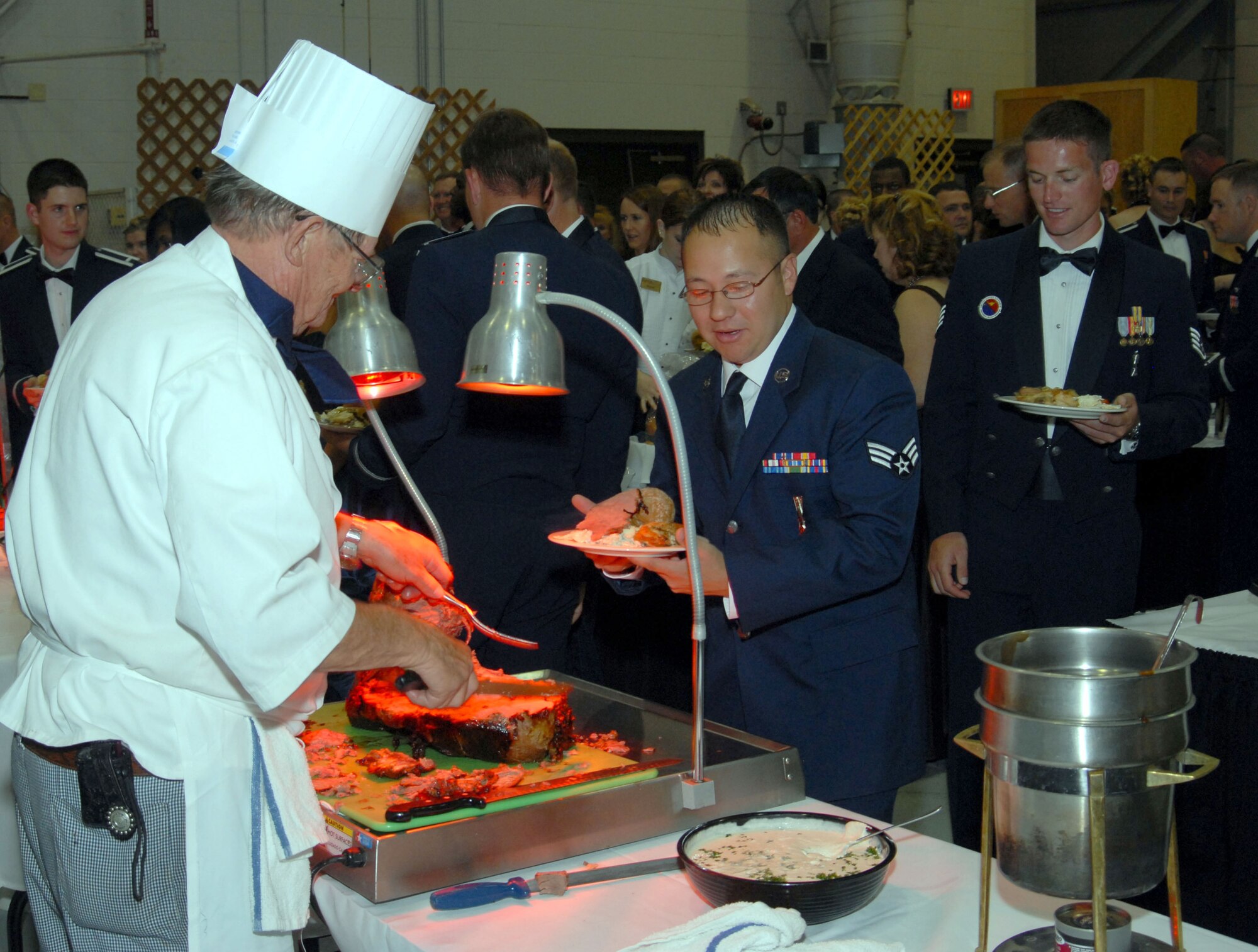 Veteran chef Warren Davis tends to one of the carving stations at the "Heritage to Horizons" 60th Anniversary Air Force Ball Sept. 15. More than 700 Team Malmstrom members attended the event. (U.S. Air Force photo/John Turner)
