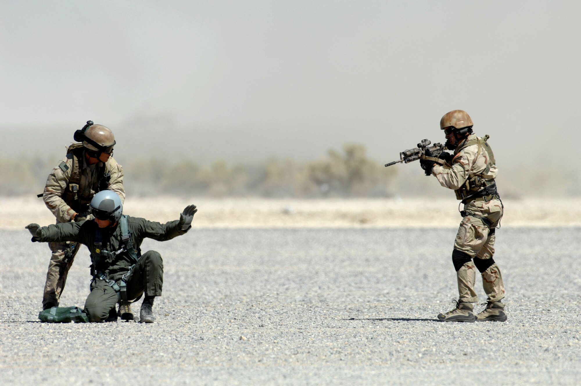 Pararescuemen from the 58th Rescue Squadron at Nellis Air Force Base, Nev., demonstrate combat search and rescue operations while rescuing a simulated downed pilot during a firepower demonstration Sept. 14 on the Nevada Test and Training Range. The demonstration gave the general public a close-up and realistic view into the Air Force's ability to perform its wartime mission. (U.S. Air Force photo/Airman 1st Class Brian Ybarbo) 
