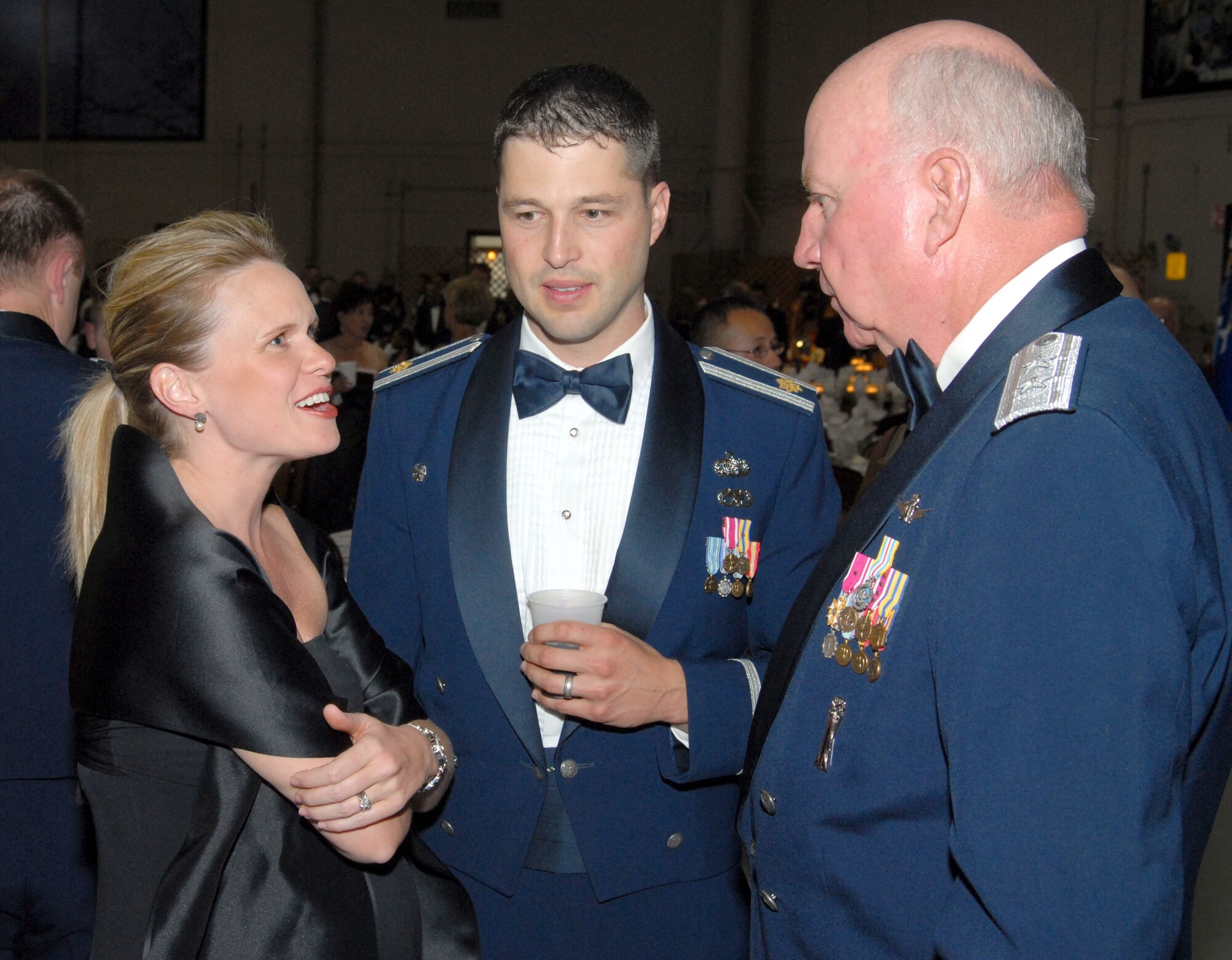 Maj. Gen. Thomas Deppe, Air Force Space Command vice commander, talks to Maj. William Belei (center) 341st Communications Squadron commander, and his wife, Maureen, at the Malmstrom "Heritage to Horizons" 60th Anniversary Air Force Ball Sept. 15. The general was the guest speaker for the evening's event. (U.S. Air Force photo/John Turner).