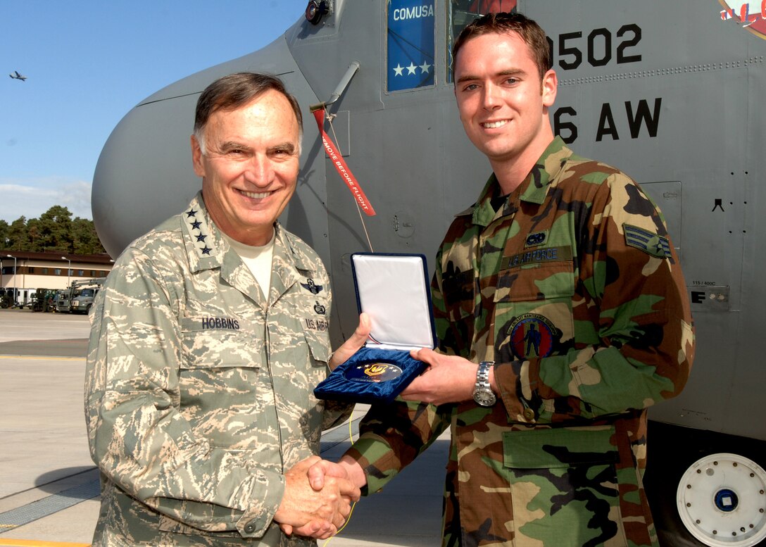 Gen. Tom Hobbins, U.S. Air Forces in Europe commander, presents Senior Airman Arron Jenkins, 86th Air Maintenance Squadron, electro-environmental technician, with the ACE award September 19. The 86 Maintenance Group's Maintenance Team took second of 23 at the 2007 AMC RODEO competition. (U.S. Air Force Photo by Airman 1st Class Kelly LeGuillon) 