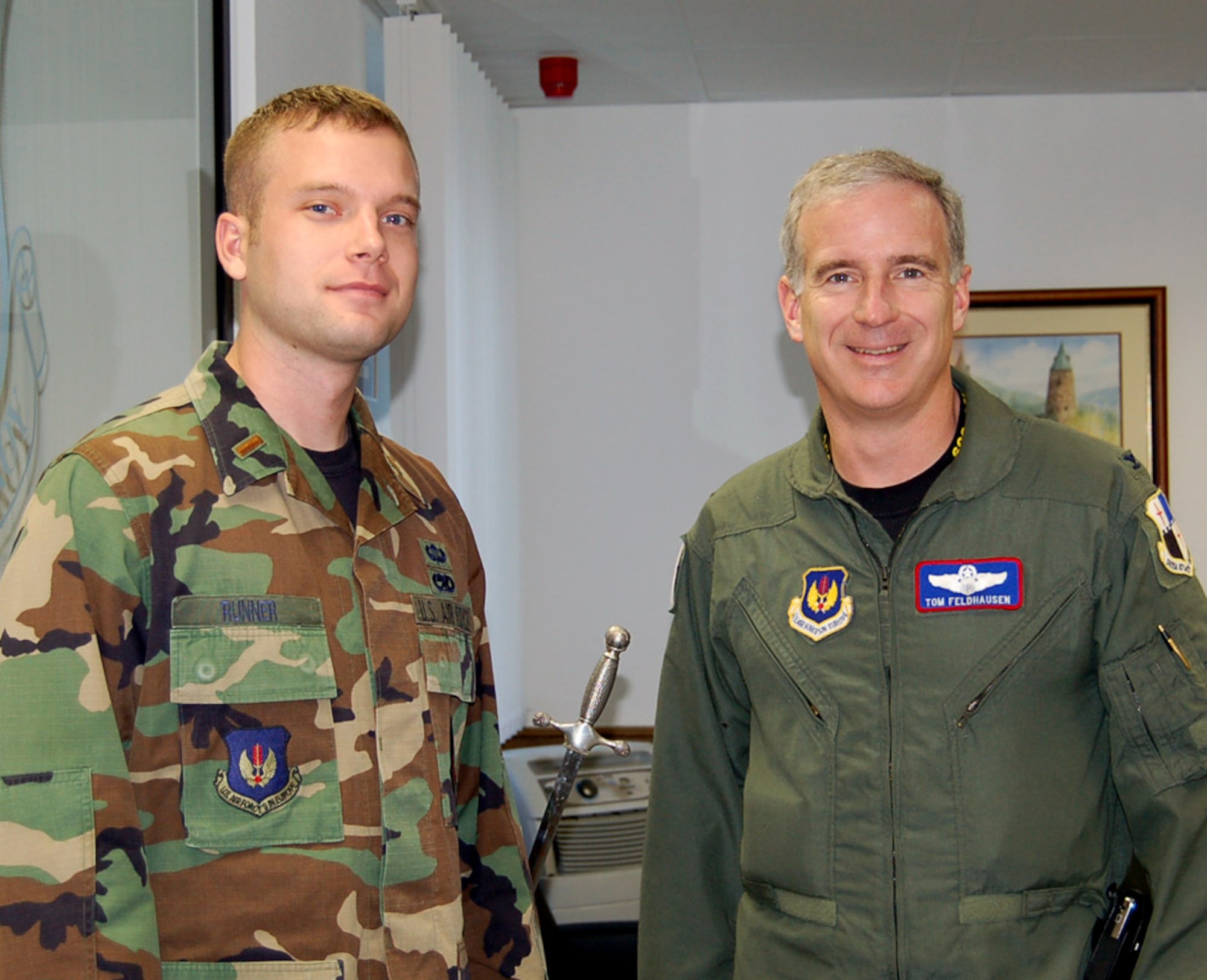 SPANGDAHLEM AIR BASE – 2nd Lt. James Runner, 52nd Component Maintenance Squadron, poses for a photo with Col. Thomas Feldhausen, 52nd Fighter Wing vice commander, before going to a meeting Sept. 19. Lieutenant Runner spent the day shadowing the 52nd FW commander and vice commander as part of the Commander’s Shadow Program. Lieutenant Runner, a native of Billings, Mont., is the accessories flight commander. In this position, he leads approximately 90 maintenance personnel providing equipment support for the A/0A-10 and F-16 Block 50 C/D aircraft. (U.S. Air Force photo/Staff Sgt. Tammie Moore)