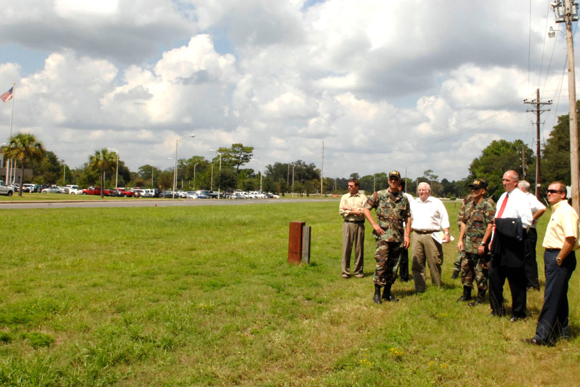 A team of base officials and Fisher House representatives survey the site for the Fisher House that will be built near Eglin's regional hospital.  The groundbreaking is projected for January 2008.  Fisher Houses provides free or low cost lodging to veterans and military families receiving treatment at military medical centers  