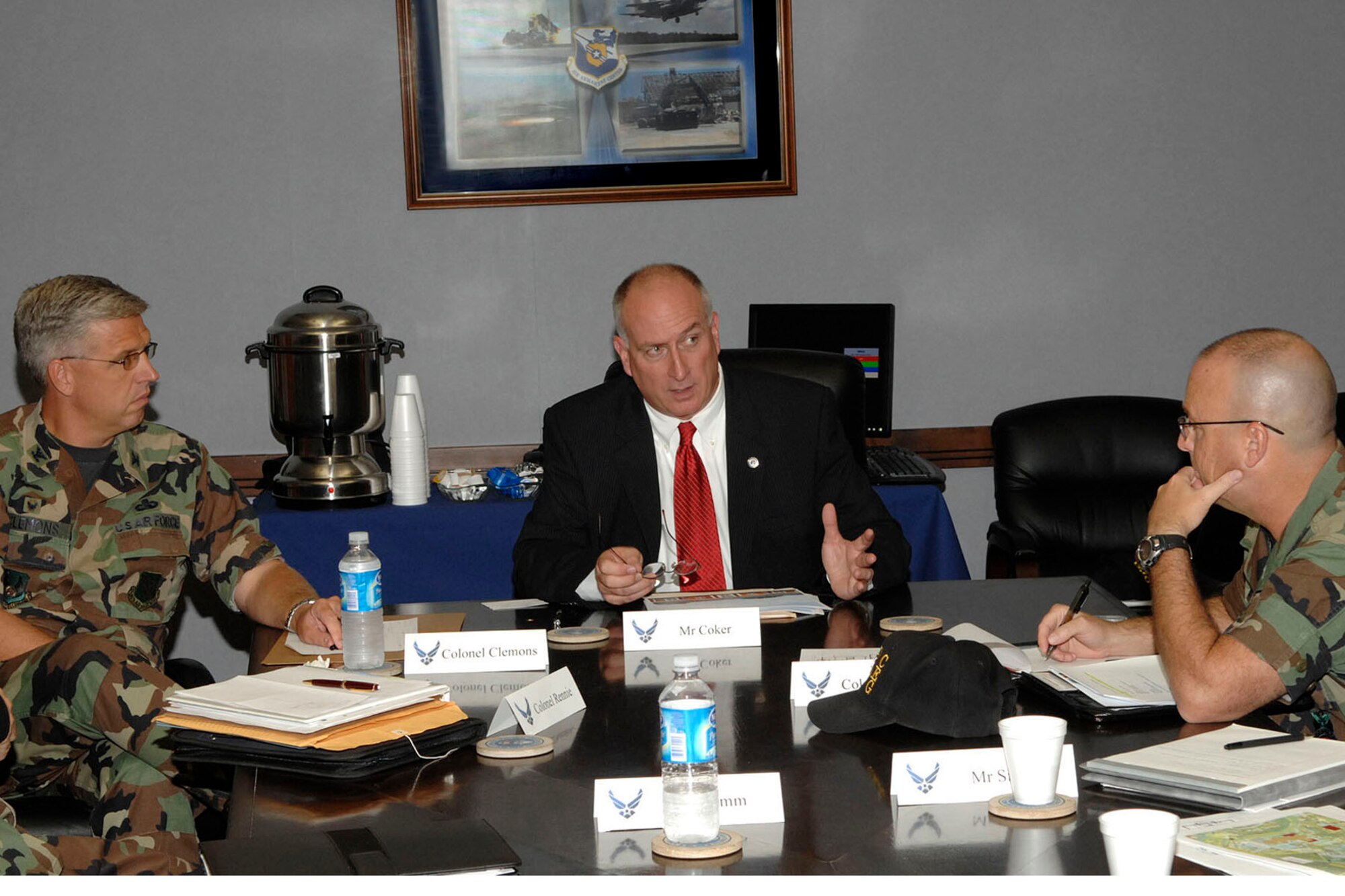 Mr. David Coker, President of the Fisher House Foundation, discusses plans for the location of Eglin's own Fishr House with Col. Dennis Yates, 96th Civil Engineer Group commander while Col. Dean Clemons, 96th Air Base Wing commander, looks on. Fisher Houses provides free or low cost lodging to veterans and military families receiving treatment at military medical centers  