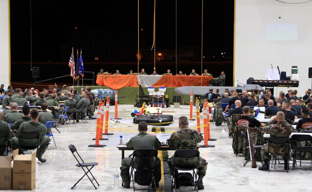 Deployed members of the 36 OG here, including bomber, fighter, tanker and support personnel, held an event in Hangar 1 to commemorate the 60th U.S. Air Force Anniversary and the culmination of a successful deployment. The dinner was catered for all the members and most engaged in an intense water gun/water balloon fight during the course of the evening. An obstacle course was set up dividing the hangar and offending members of the mess had to navigate the course to the satisfaction of the head table. (U.S. Air Force Photo/Senior Master Sgt. Mahmoud Rasouliyan)