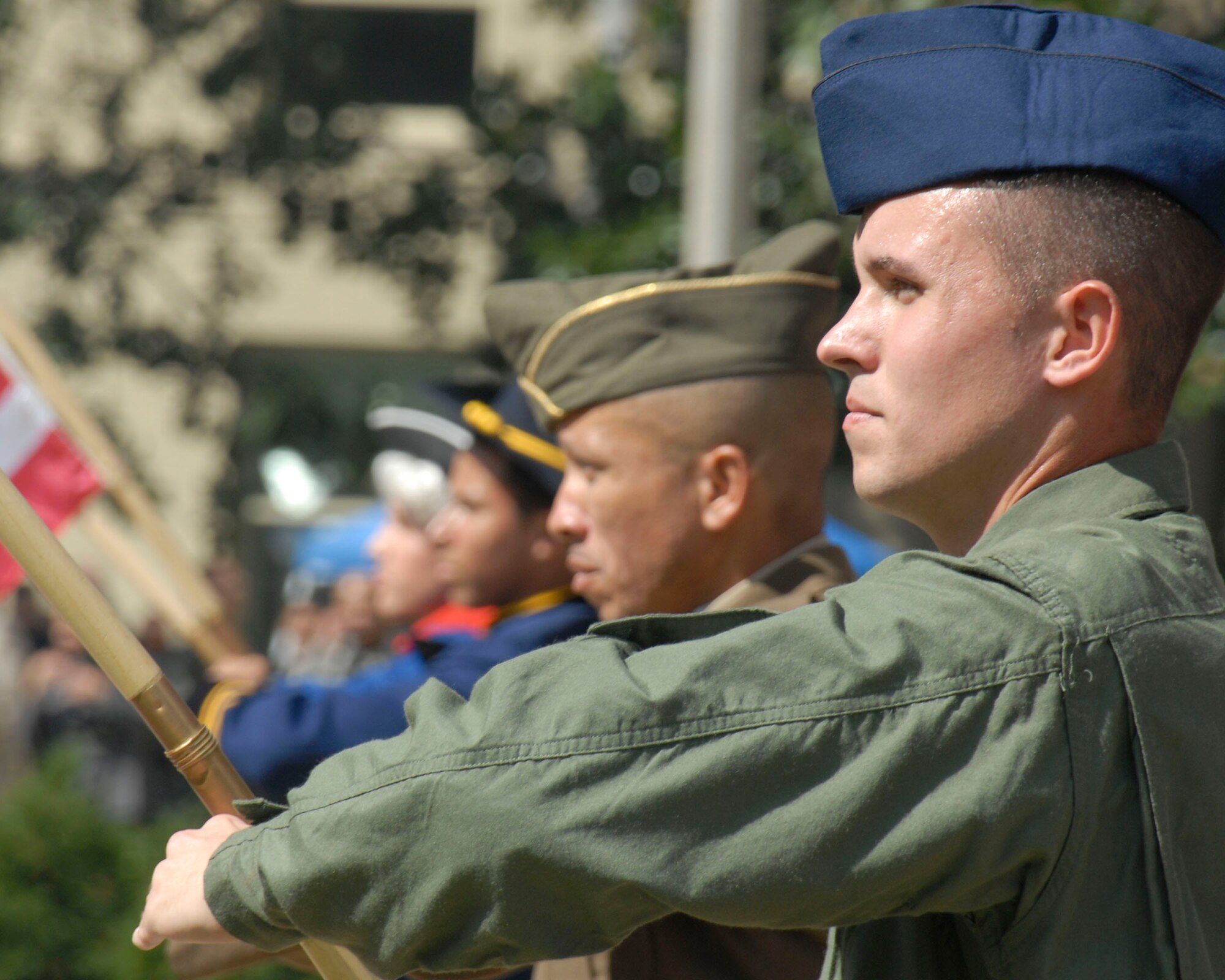 Members of the Air Force Tops in Blue pay tribute to the heritage of the American flag during a performance at the Air Force's 60th anniversary celebration in the Pentagon courtyard Sept. 18. (U.S. Air Force photo/Staff Sgt. Monique Randolph)