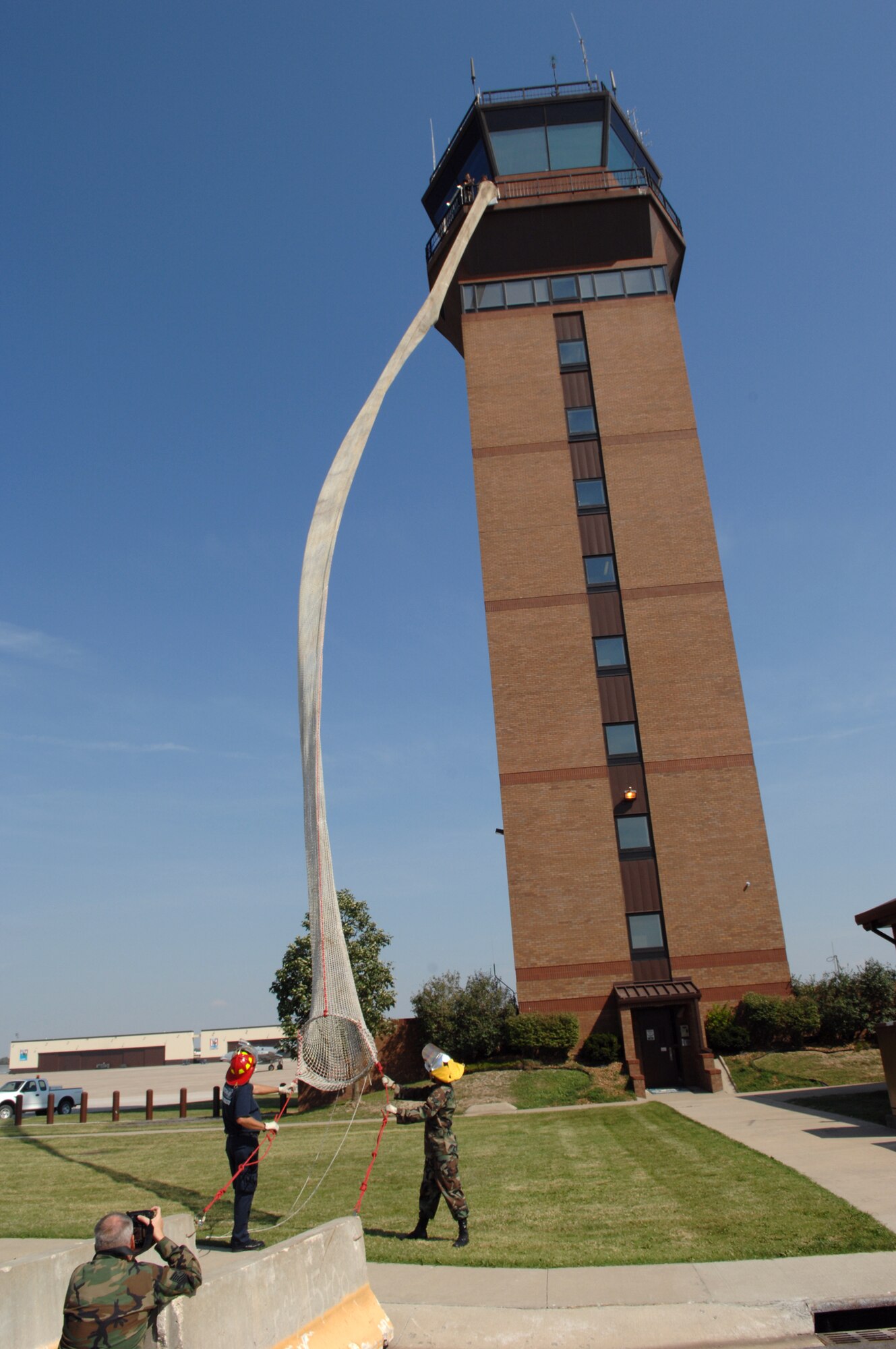 WHITEMAN AIR FORCE BASE, Mo -- A participant in the 509th Operations Support Squadron’s air traffic control tower evacuation training prepares to take the plunge into the drop shoot off the tower Sept. 18. The annual training conducted by the 509th Civil Engineer Squadron Fire Department prepares Airmen to evacuate the tower in the event of an emergency. (U.S. Air Force photo/Airman 1st Class Cory Todd)