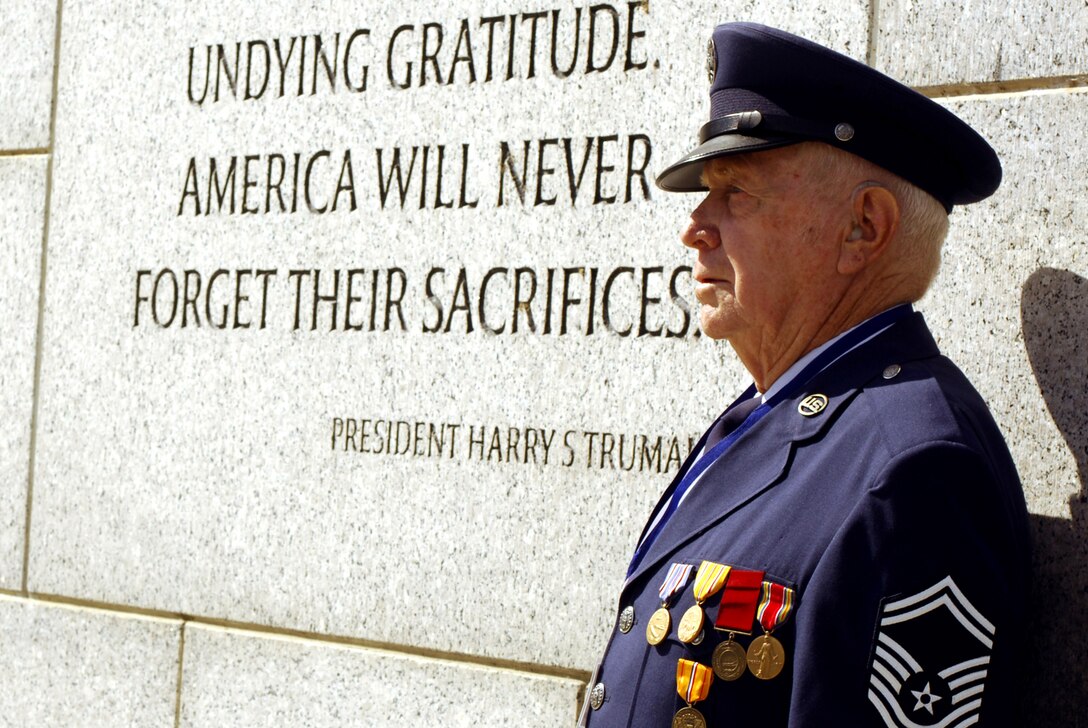 Retired Senior Master Sgt. Billy Neil poses near a quote by President Harry Truman at the National World War II Memorial during Hero Flight 2007 in Washington, D.C., Sept. 15. Hero Flight is an all-volunteer program that sets up trips to allow as many World War II veterans as possible to visit the National World War II Memorial. (U.S. Air Force photo/Staff Sgt. Suzanne Day)