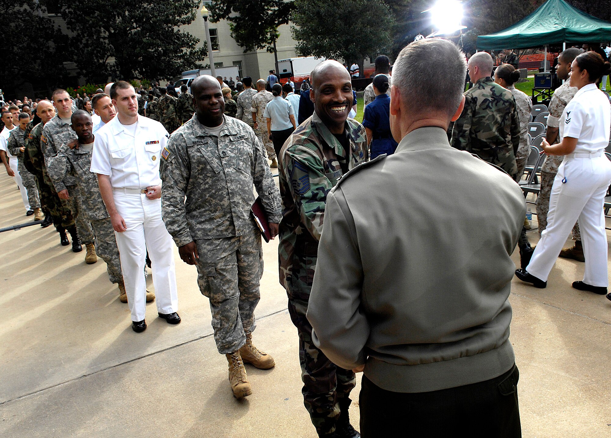 Marine Corps Gen. Peter Pace, chairman of the Joint Chiefs of Staff, thanks enlisted servicemembers for their dedication and hands out his coin during an enlisted call at the Pentagon Sept. 20. (Department of Defense photo/Cherie A. Thurlby)